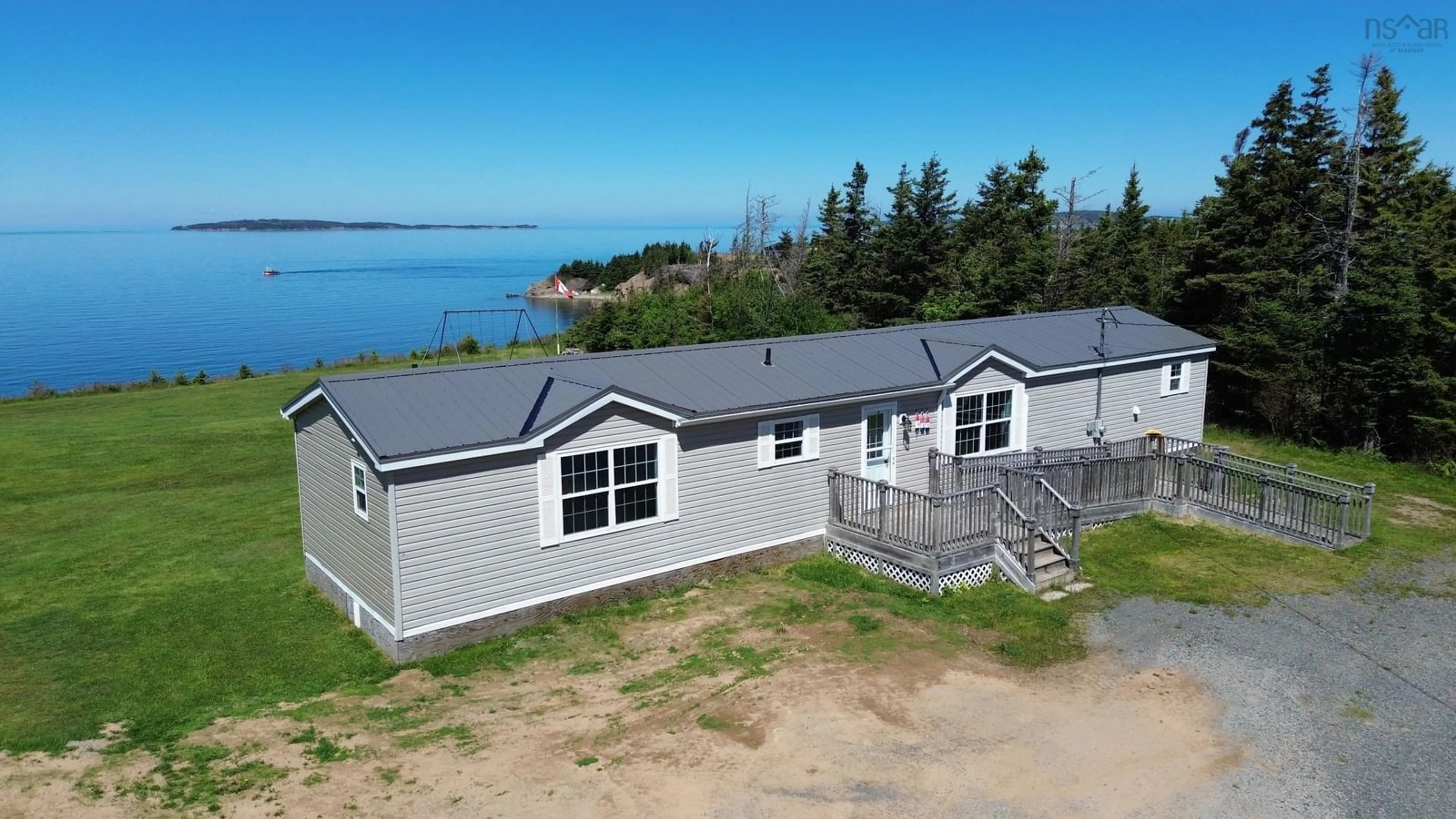 A pic from outside/outdoor area/front of a property/back of a property/a pic from drone, water/lake/river/ocean view for 444 Shore Rd, Harbourview Nova Scotia B0E 2W0
