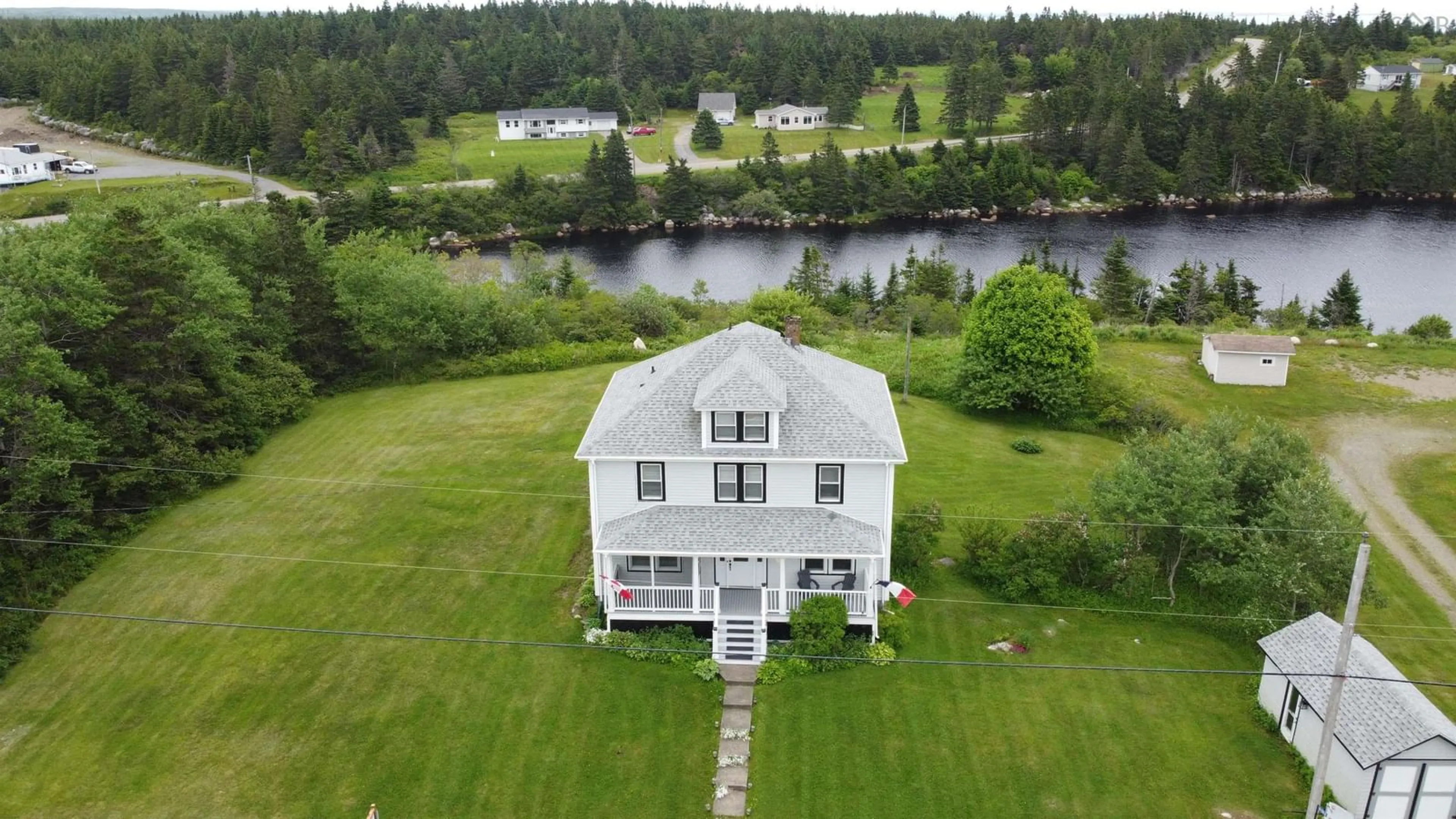 A pic from outside/outdoor area/front of a property/back of a property/a pic from drone, water/lake/river/ocean view for 6163 Highway 316, Larrys River Nova Scotia B0H 1T0