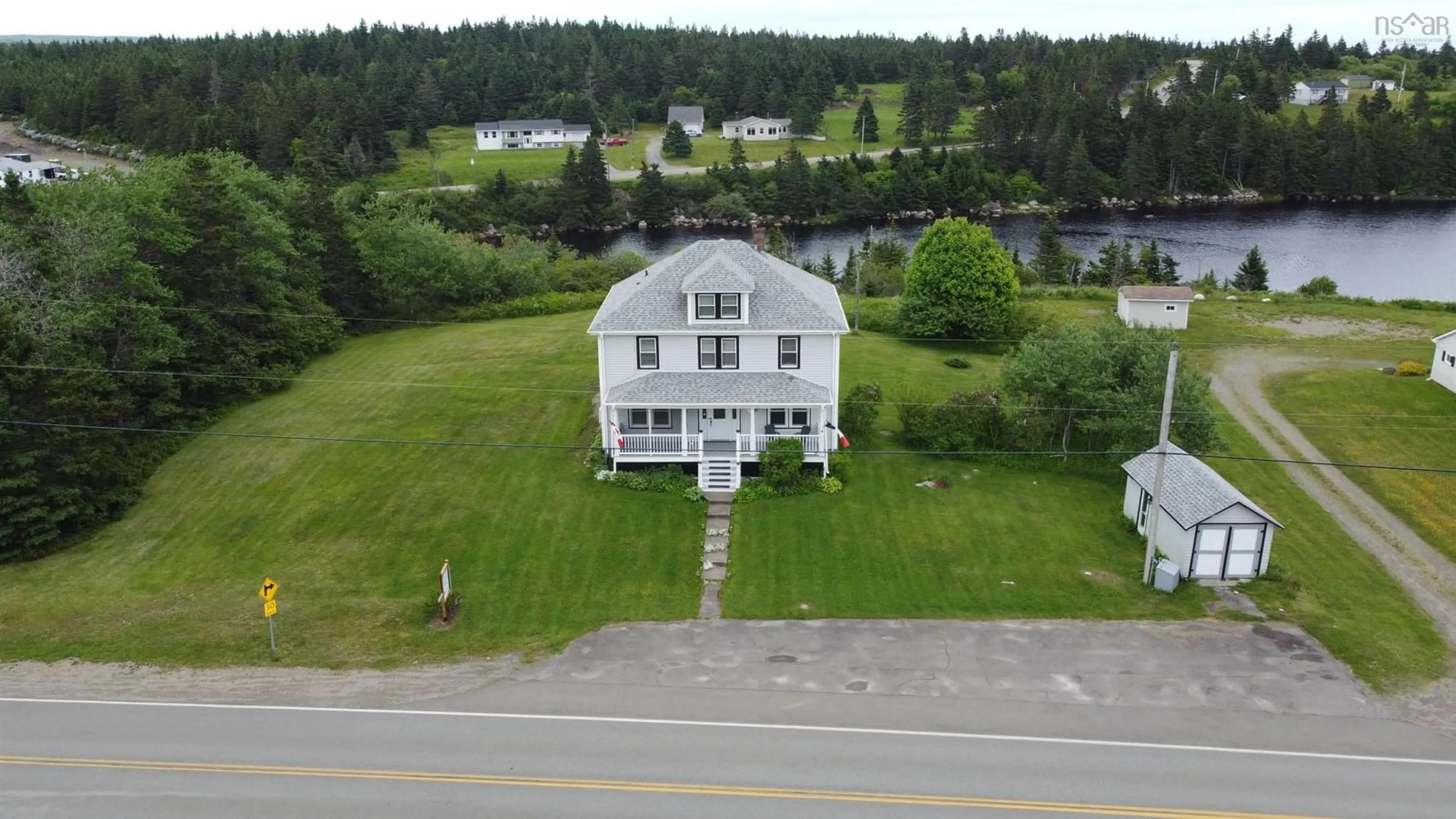 A pic from outside/outdoor area/front of a property/back of a property/a pic from drone, water/lake/river/ocean view for 6163 Highway 316, Larrys River Nova Scotia B0H 1T0