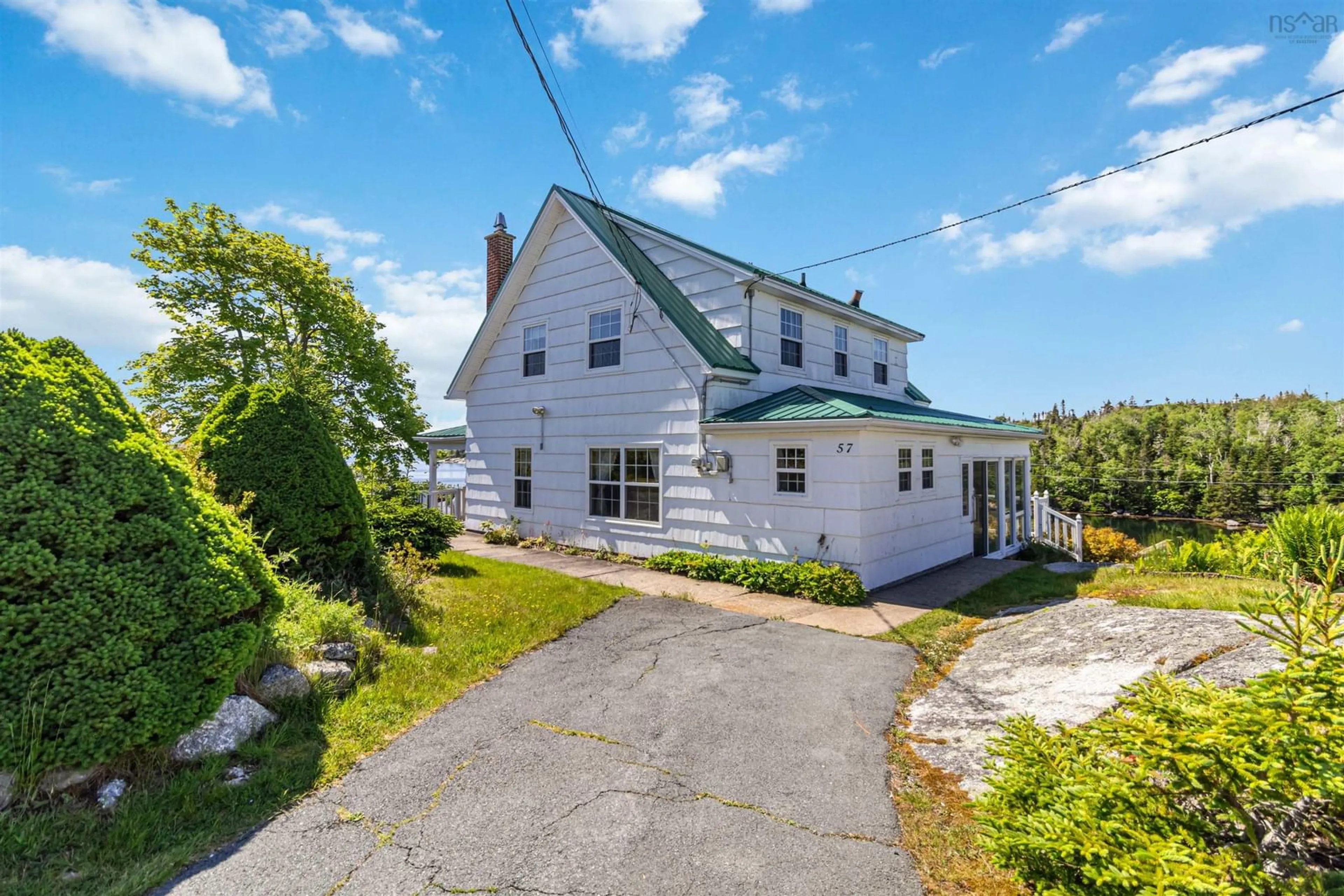 A pic from outside/outdoor area/front of a property/back of a property/a pic from drone, street for 57 Learys Cove Road, East Dover Nova Scotia B3Z 3W7