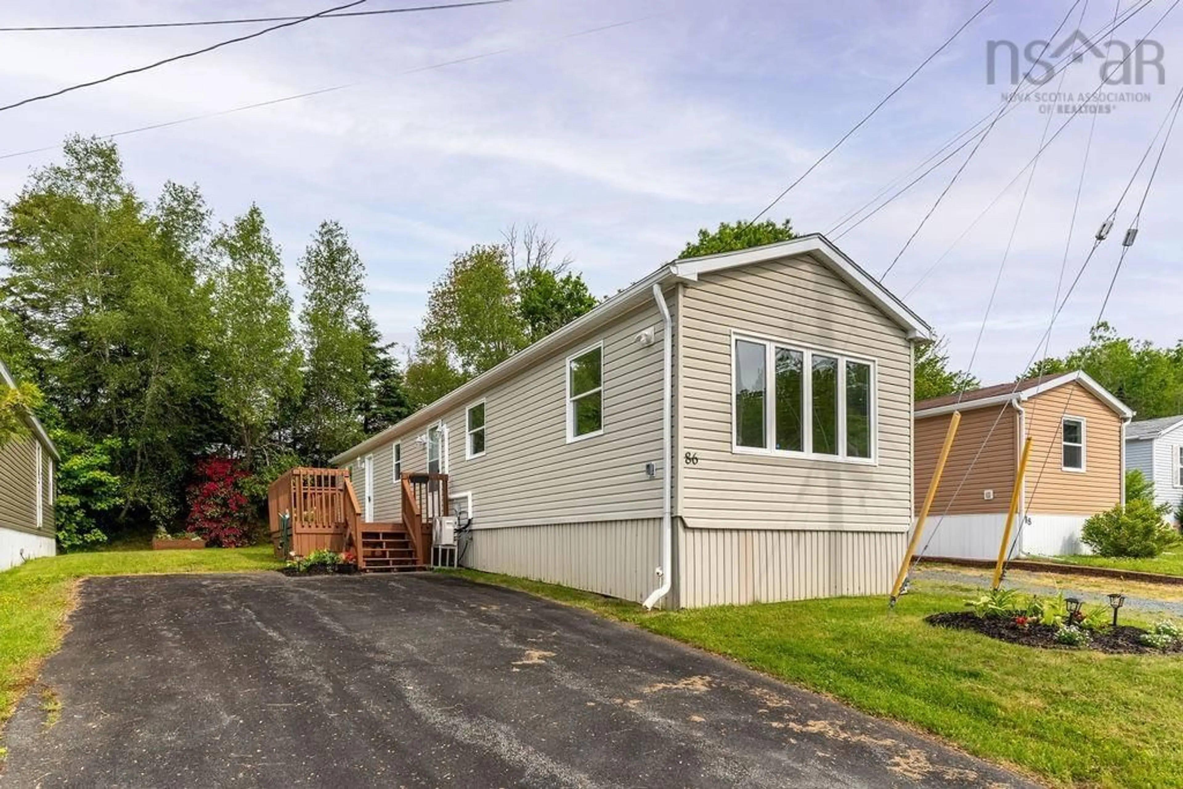 Home with vinyl exterior material, street for 86 Brook St, Middle Sackville Nova Scotia B4E 1B9