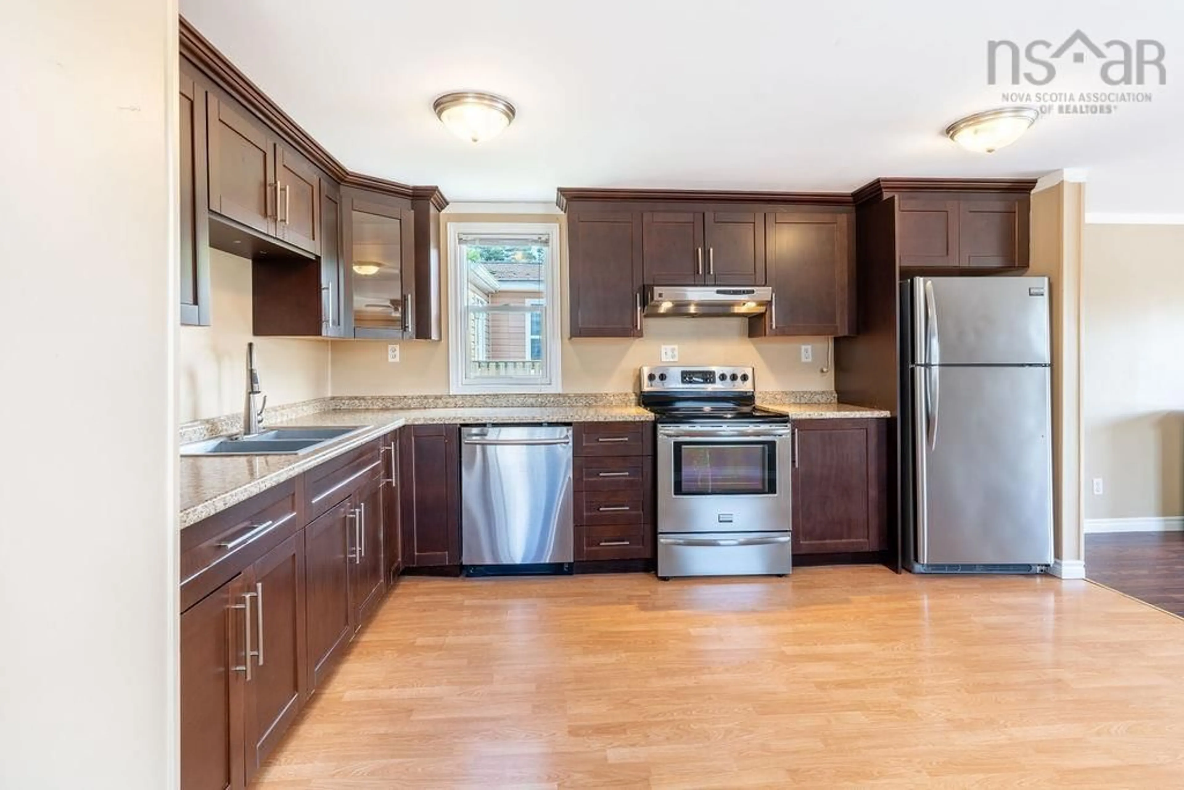 Open concept kitchen, wood/laminate floor for 86 Brook St, Middle Sackville Nova Scotia B4E 1B9