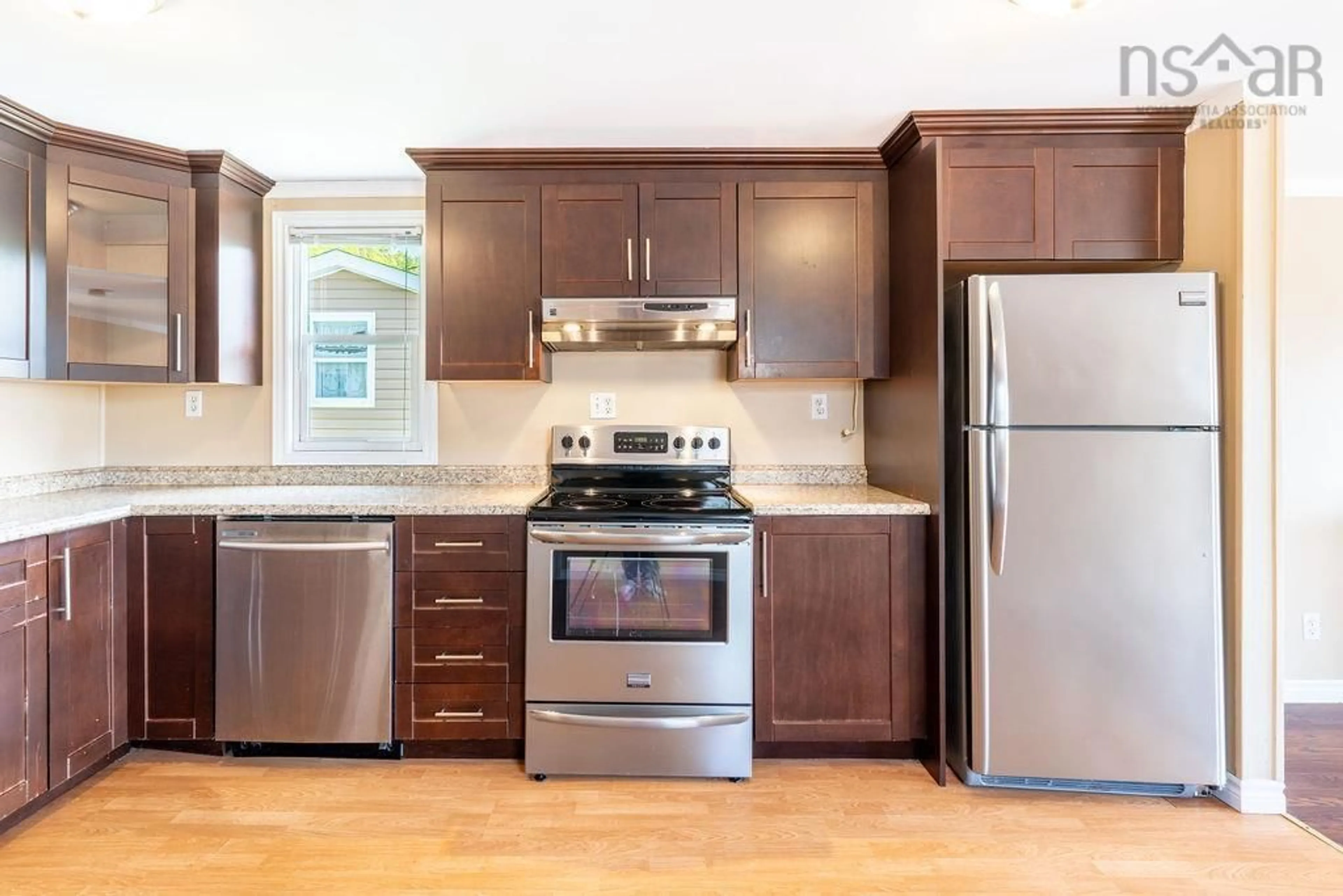 Open concept kitchen, wood/laminate floor for 86 Brook St, Middle Sackville Nova Scotia B4E 1B9