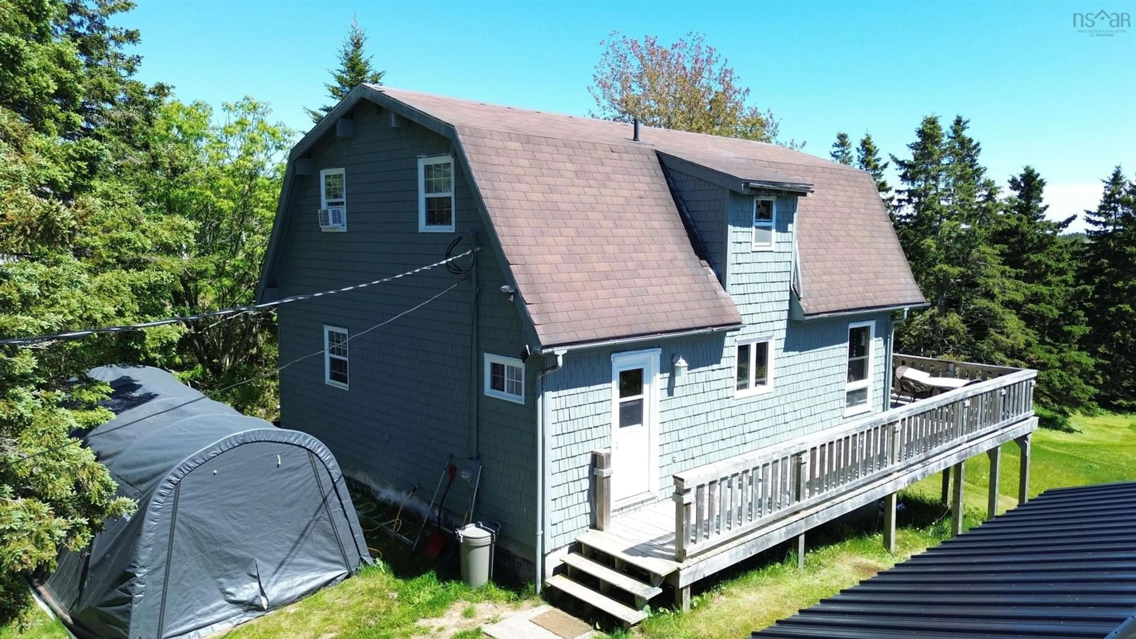 A pic from outside/outdoor area/front of a property/back of a property/a pic from drone, unknown for 8710 Highway 4, River Bourgeois Nova Scotia B0E 2X0