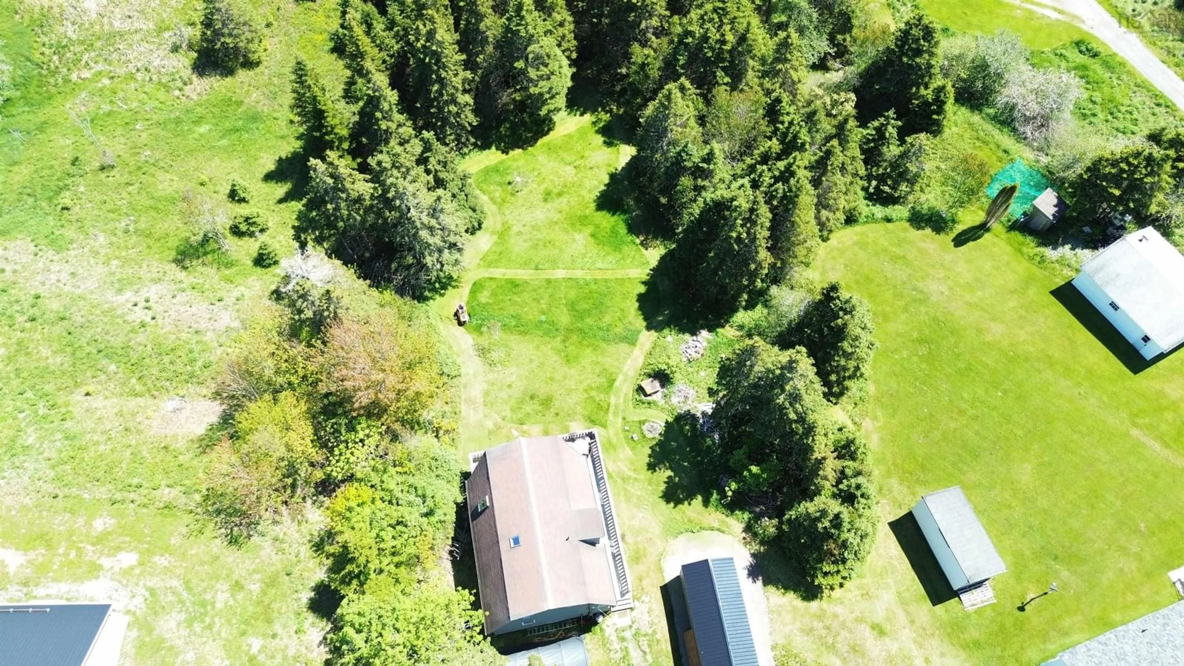 A pic from outside/outdoor area/front of a property/back of a property/a pic from drone, forest/trees view for 8710 Highway 4, River Bourgeois Nova Scotia B0E 2X0