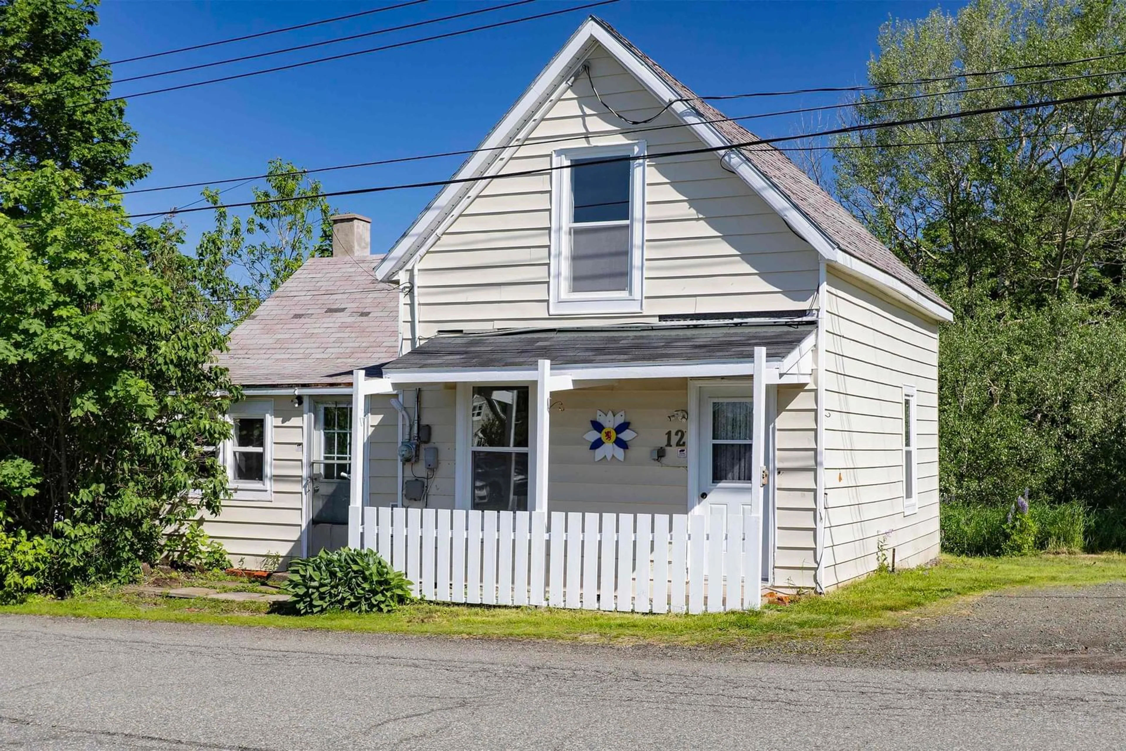 Home with vinyl exterior material, street for 12 Clarence St, Springhill Nova Scotia B0M 1X0