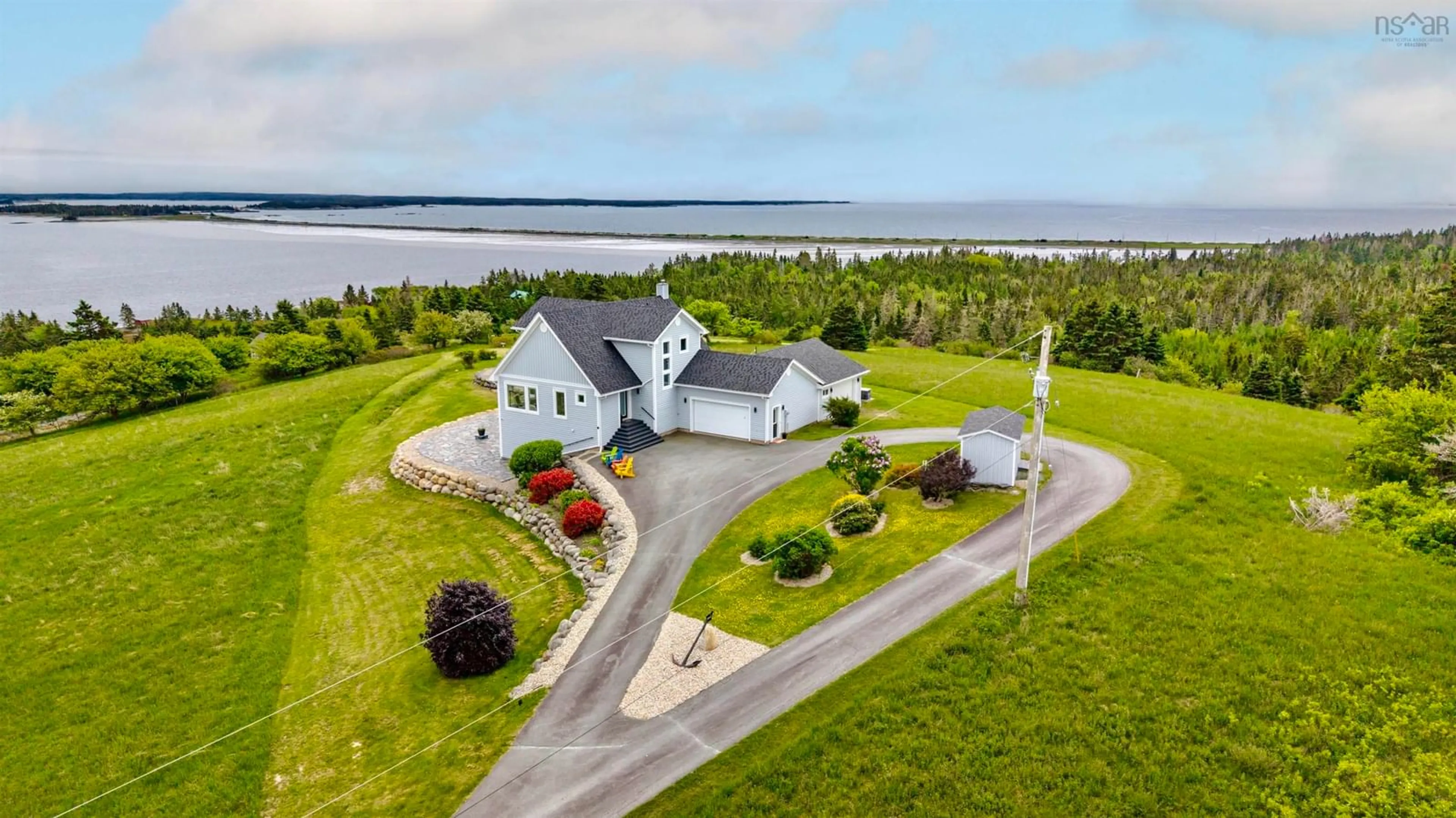 A pic from outside/outdoor area/front of a property/back of a property/a pic from drone, water/lake/river/ocean view for 101 Razilly Lane, Crescent Beach Nova Scotia B0R 1C0