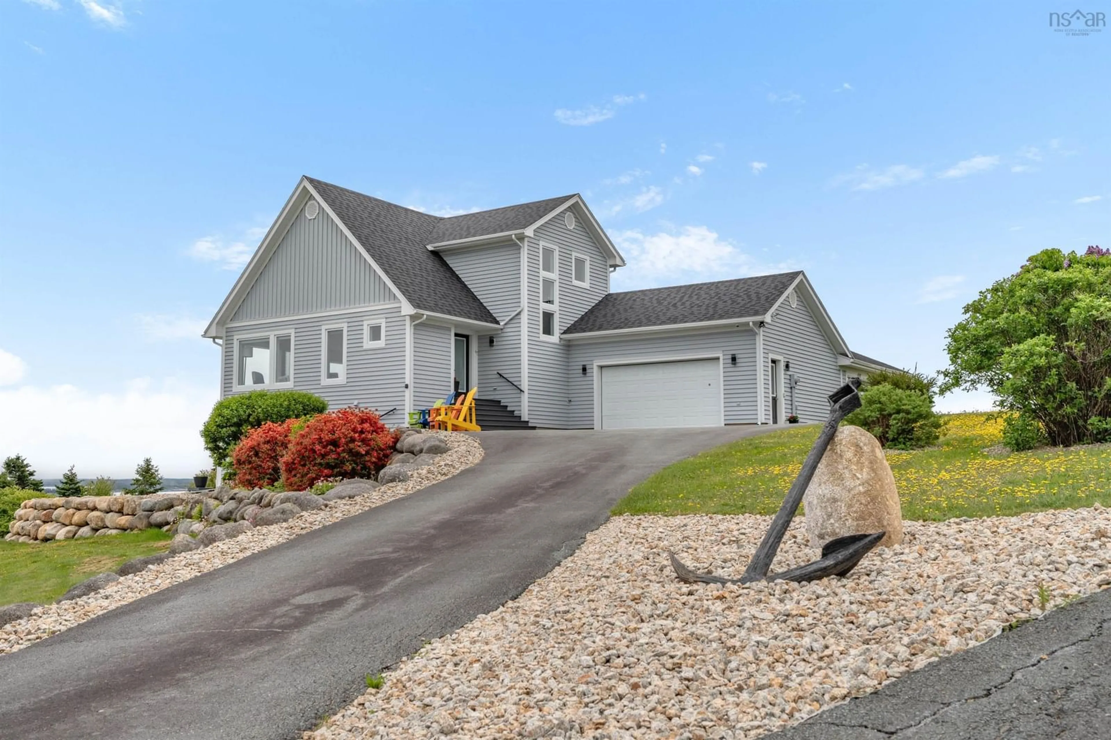 Home with vinyl exterior material, street for 101 Razilly Lane, Crescent Beach Nova Scotia B0R 1C0