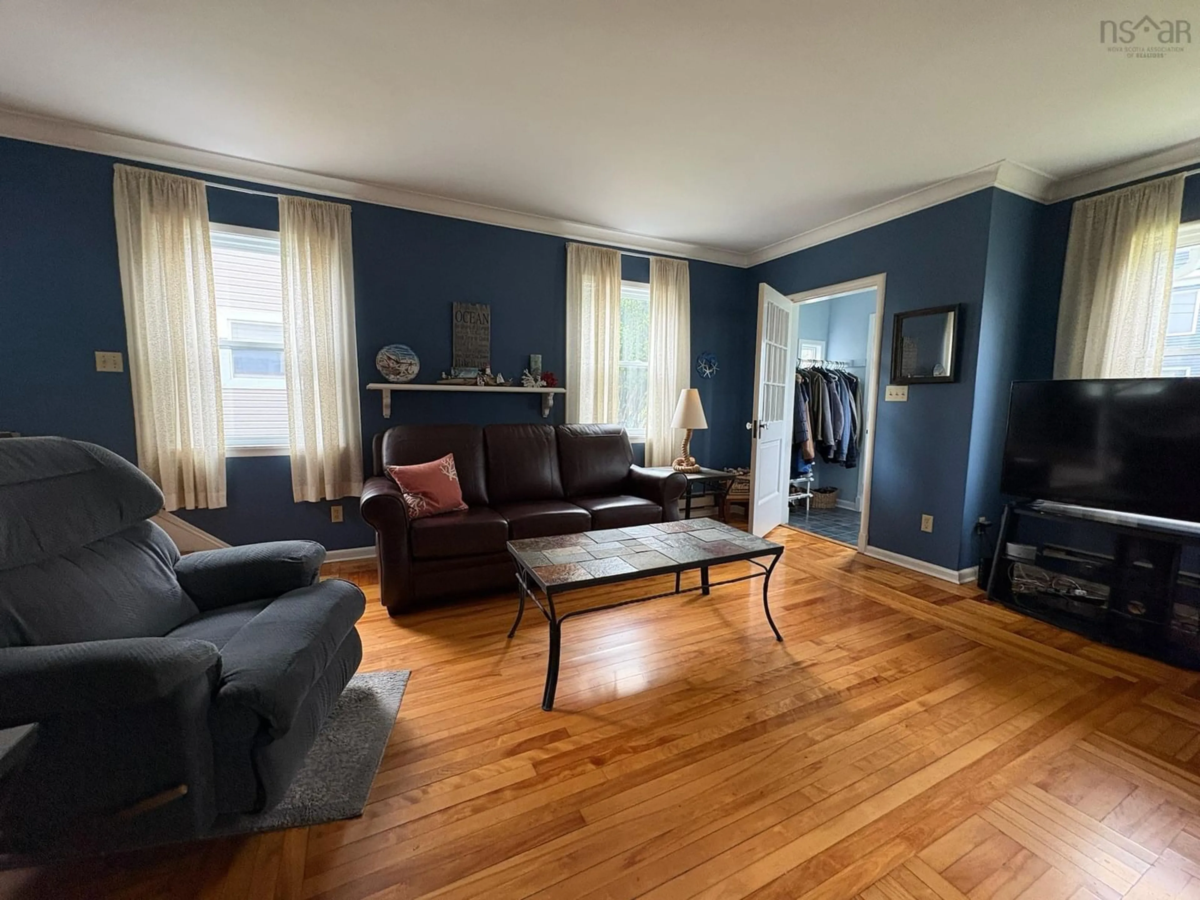 Living room with furniture, wood/laminate floor for 458 Robie St, Truro Nova Scotia B2N 1M3