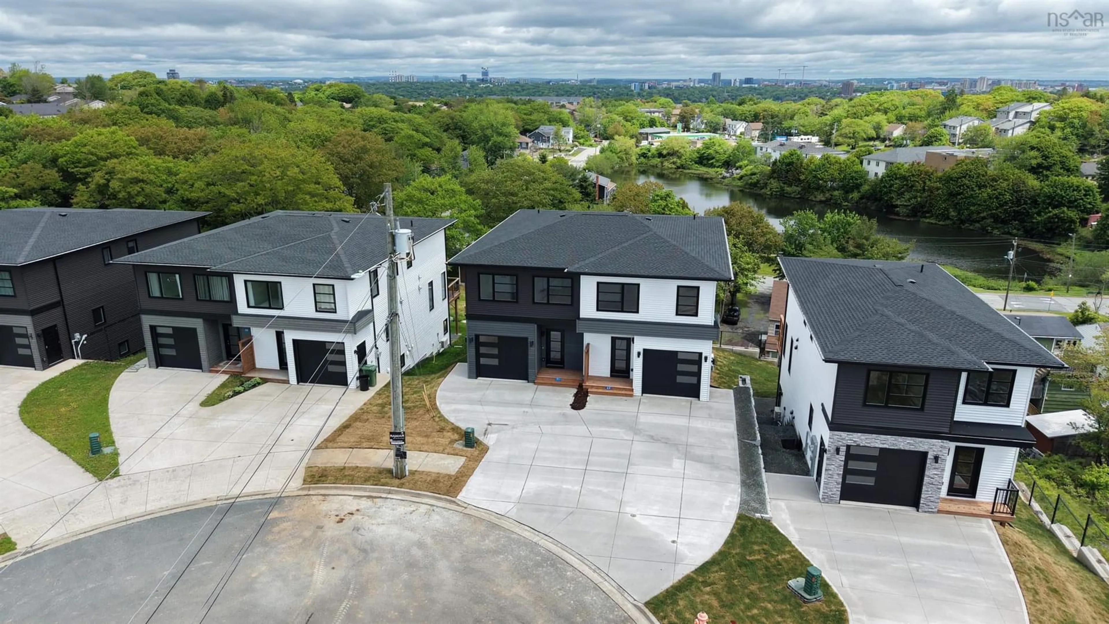 A pic from outside/outdoor area/front of a property/back of a property/a pic from drone, street for 71 Grenoble Crt, Long Lake Nova Scotia B3P 0J8