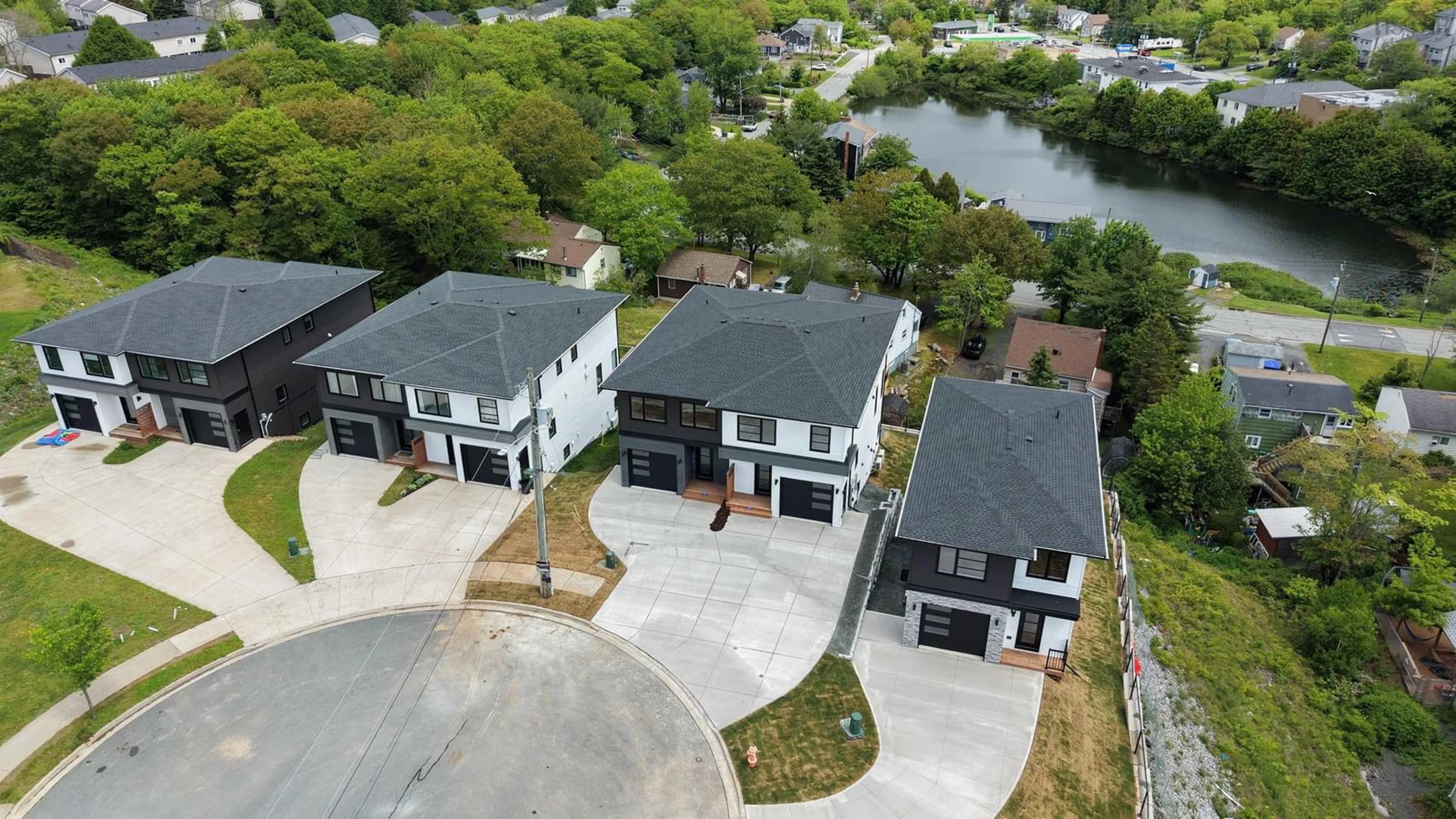 A pic from outside/outdoor area/front of a property/back of a property/a pic from drone, water/lake/river/ocean view for 71 Grenoble Crt, Long Lake Nova Scotia B3P 0J8