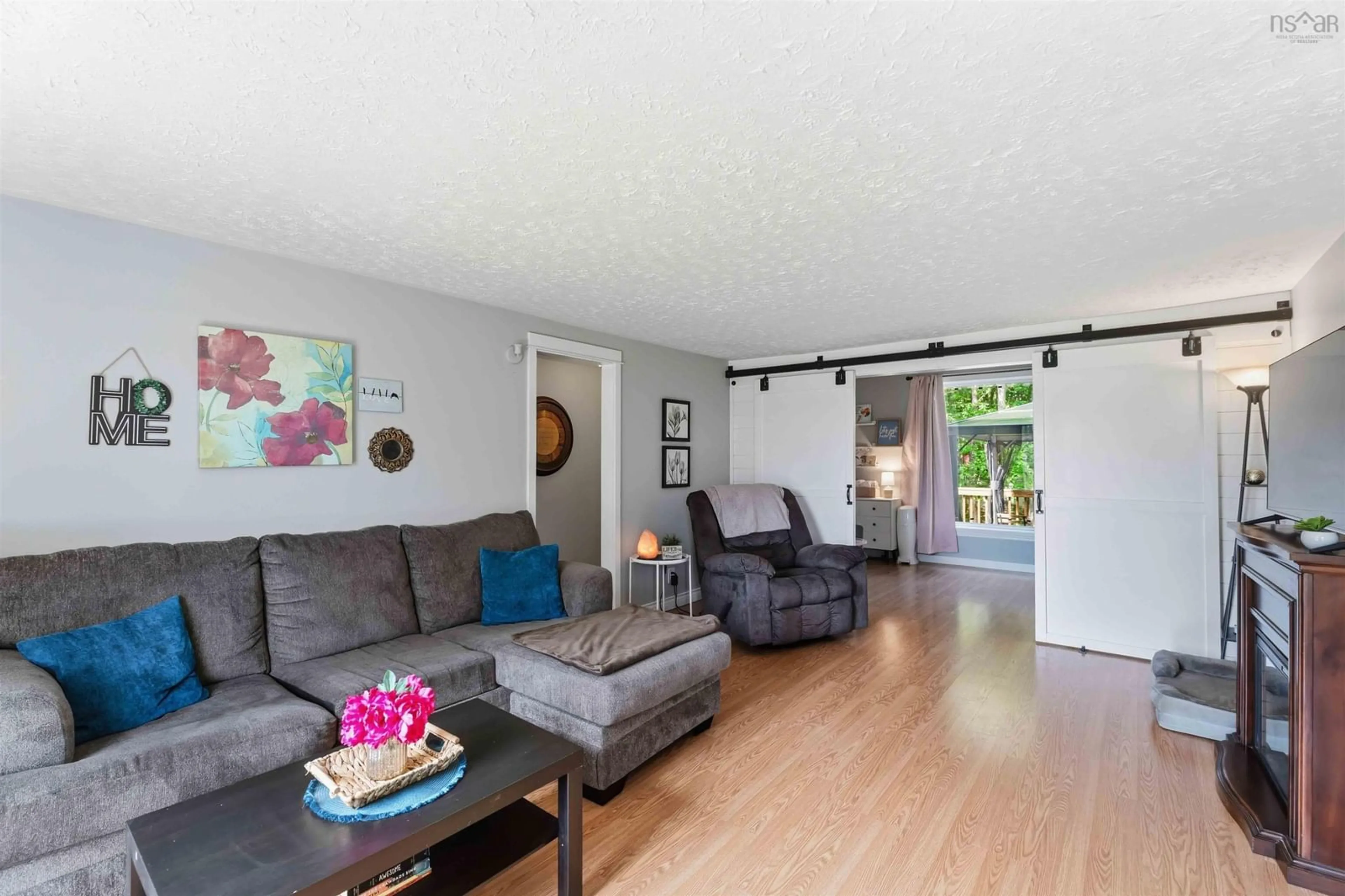 Living room with furniture, wood/laminate floor for 61 Nictaux Rd, Nictaux Nova Scotia B0S 1P0