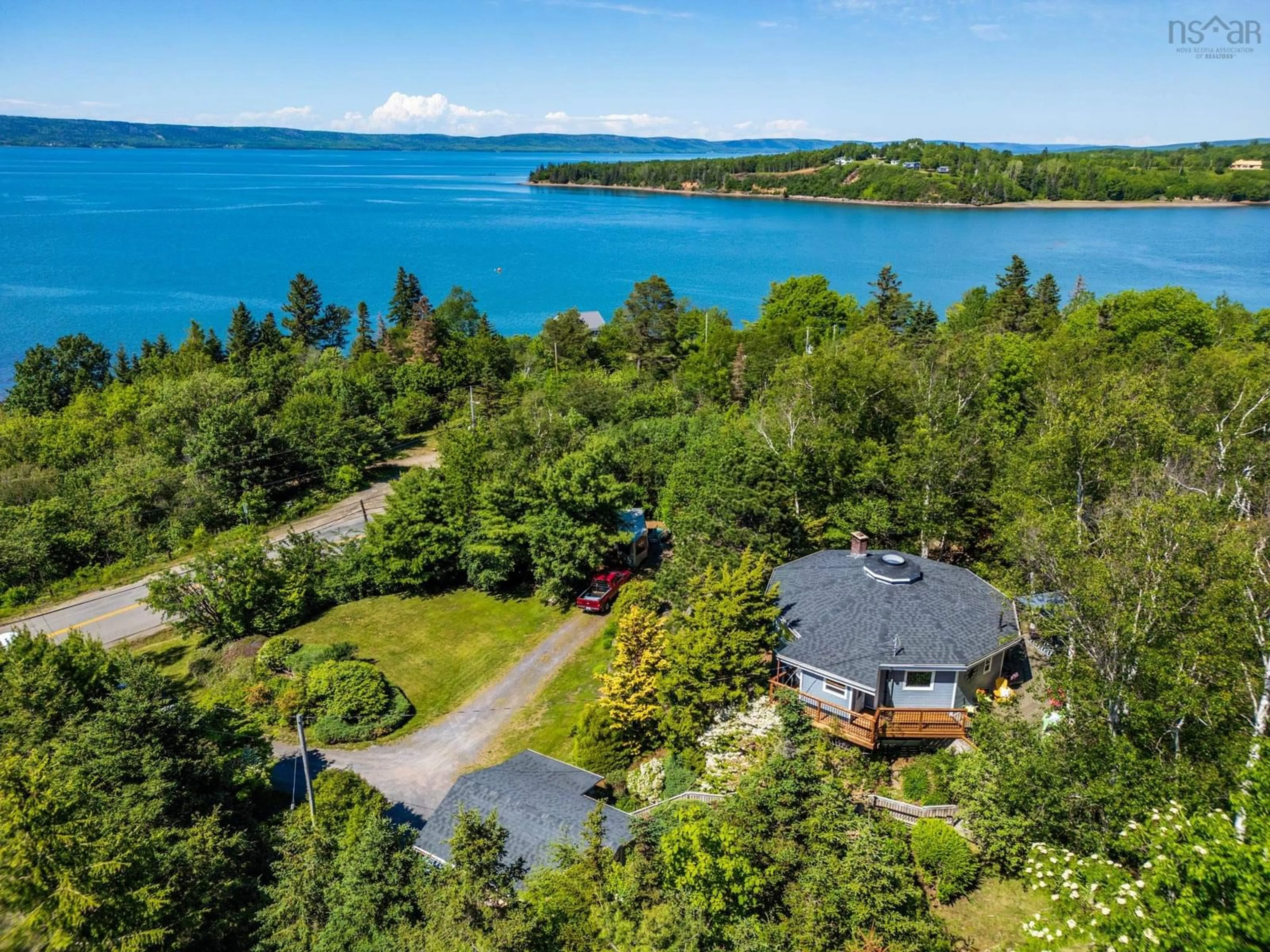 A pic from outside/outdoor area/front of a property/back of a property/a pic from drone, water/lake/river/ocean view for 894 Highway 1, Smiths Cove Nova Scotia B0S 1S0