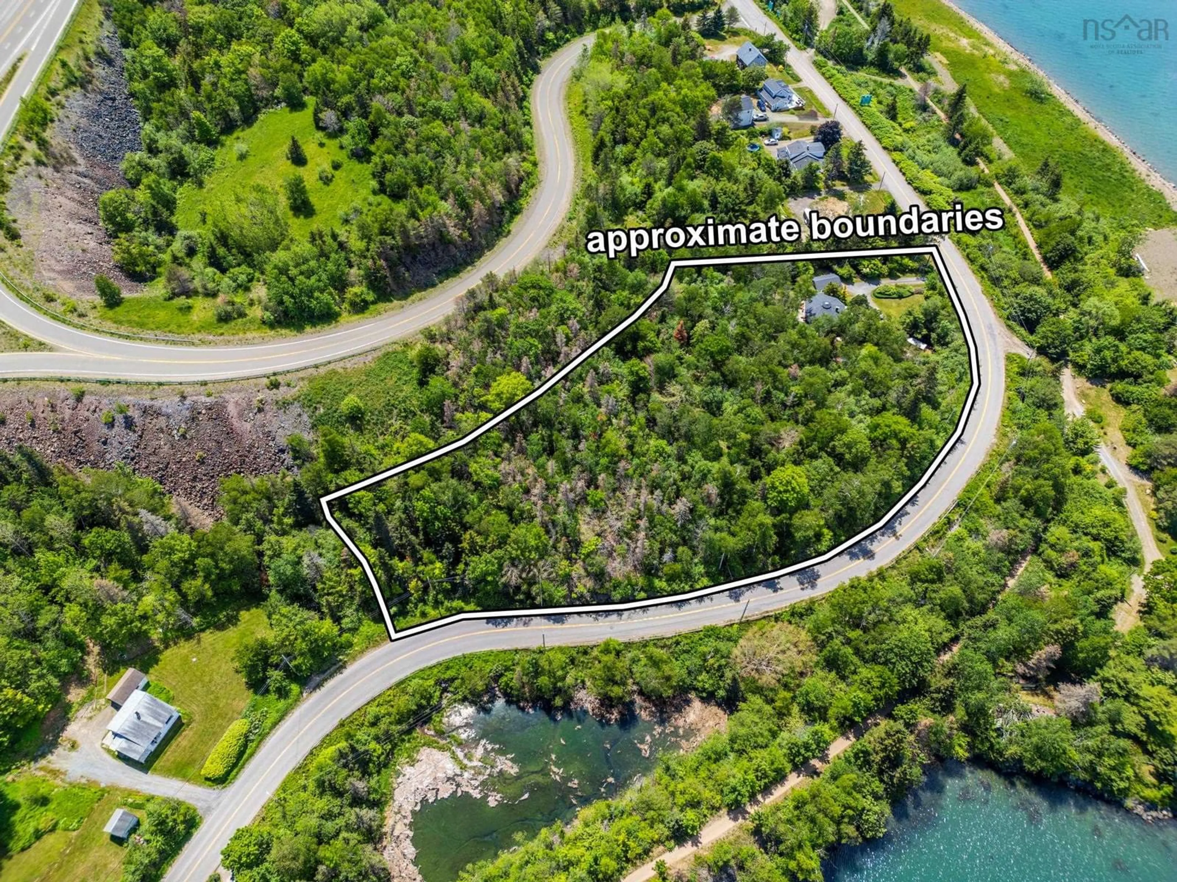 A pic from outside/outdoor area/front of a property/back of a property/a pic from drone, water/lake/river/ocean view for 894 Highway 1, Smiths Cove Nova Scotia B0S 1S0