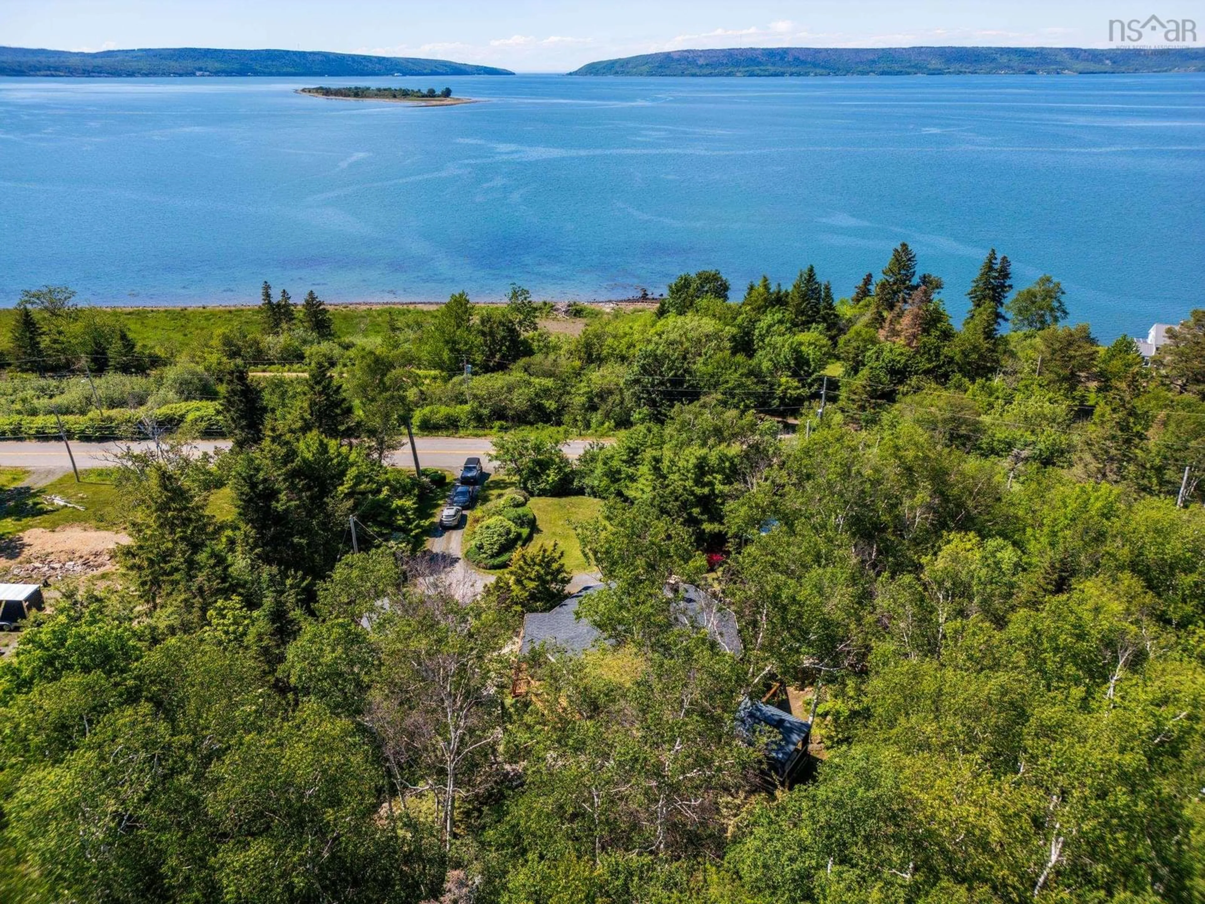 A pic from outside/outdoor area/front of a property/back of a property/a pic from drone, water/lake/river/ocean view for 894 Highway 1, Smiths Cove Nova Scotia B0S 1S0