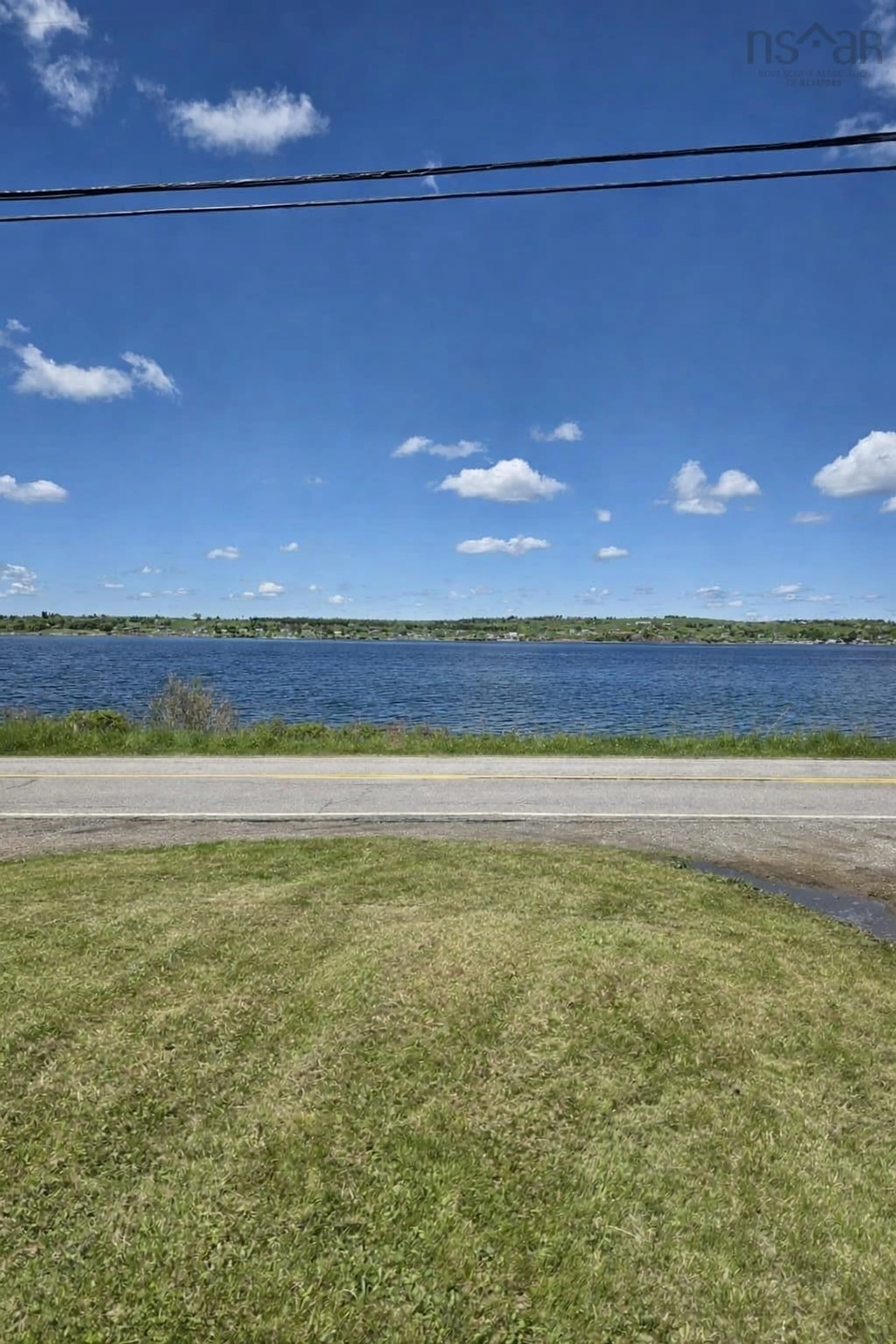 A pic from outside/outdoor area/front of a property/back of a property/a pic from drone, water/lake/river/ocean view for 2345 Highway 239 Hwy, Point Edward Nova Scotia B2A 4R3
