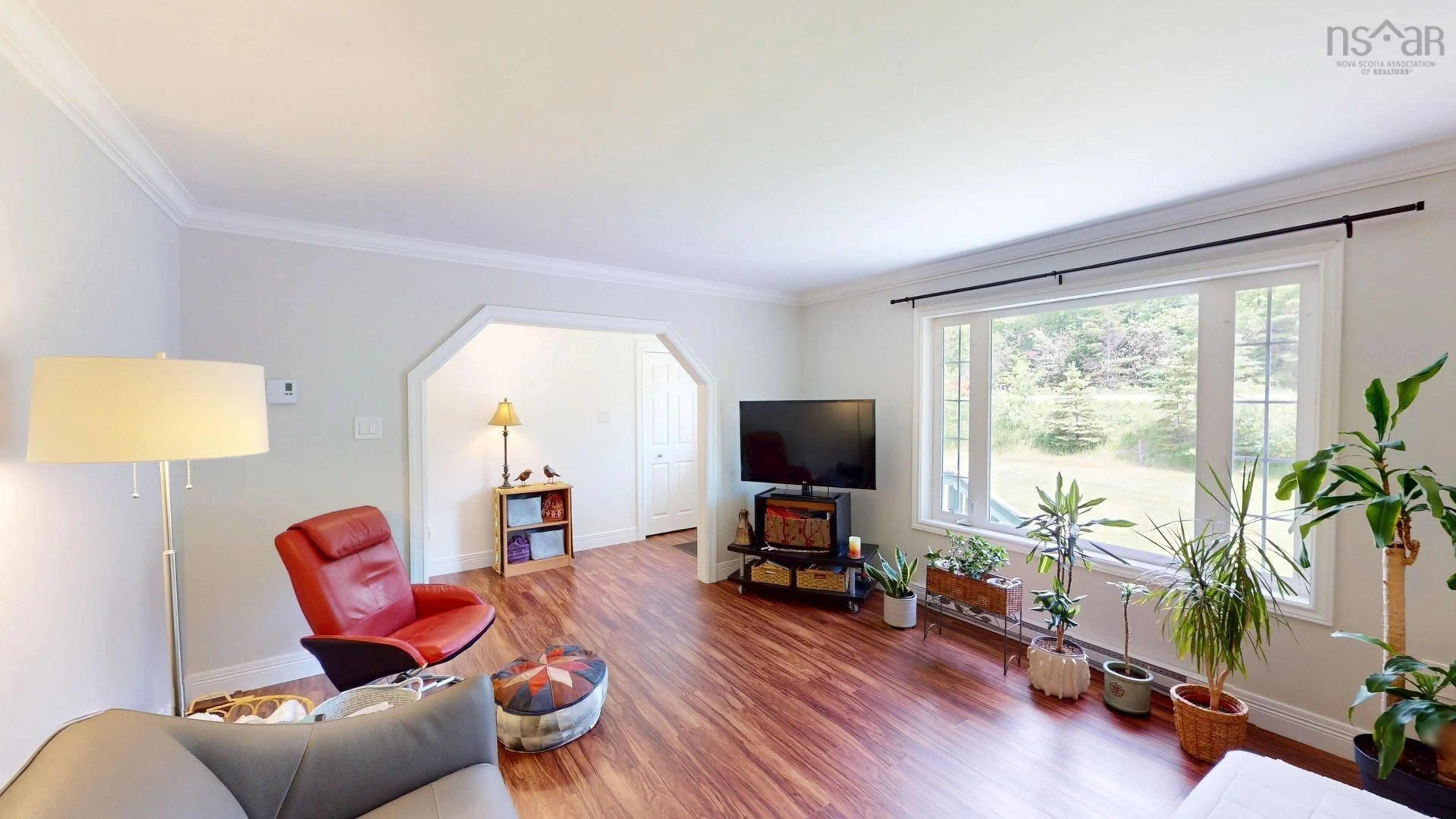 Living room with furniture, wood/laminate floor for 25 Rothwell St, Upper Sackville Nova Scotia B4E 3C2