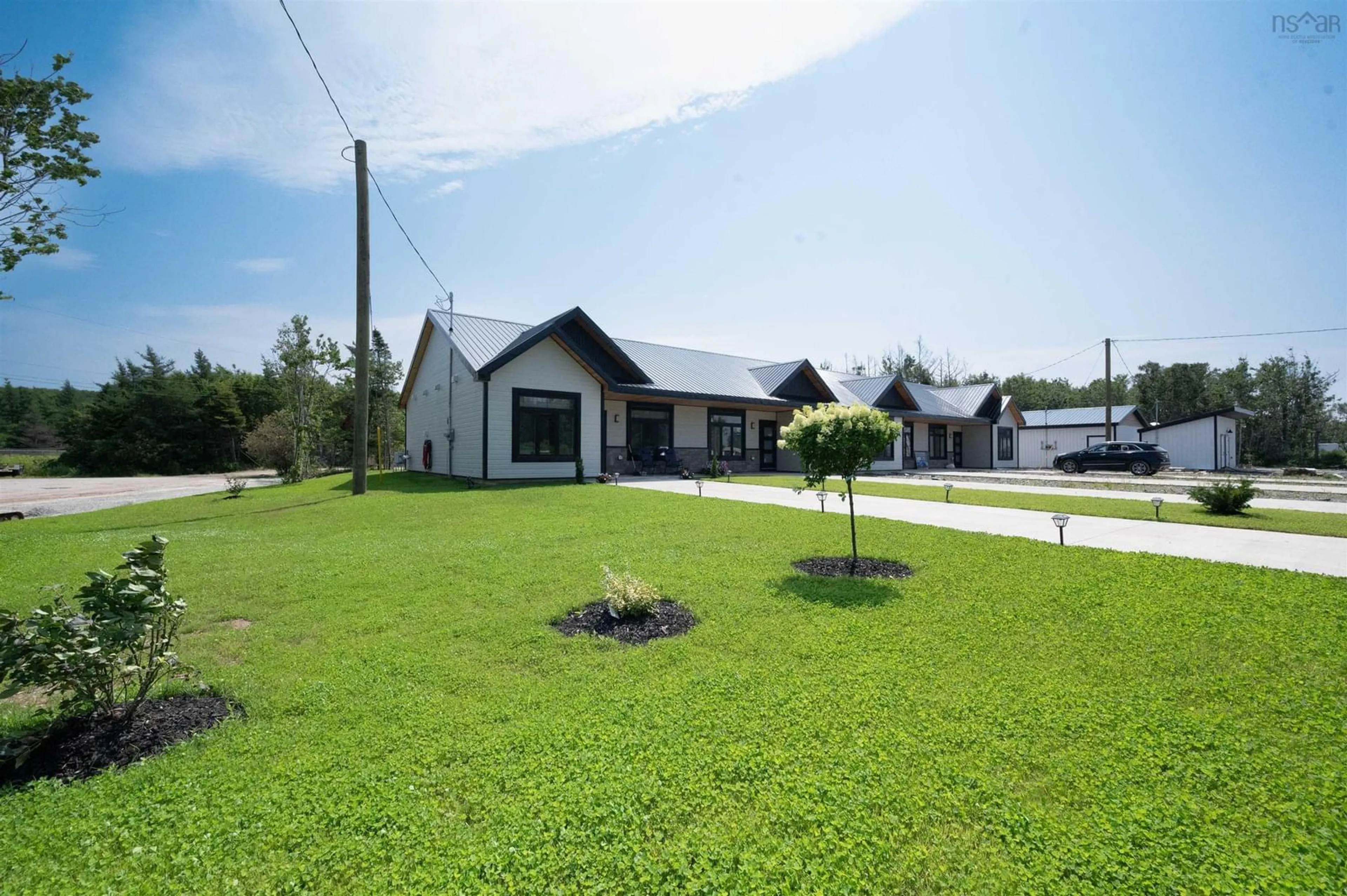A pic from outside/outdoor area/front of a property/back of a property/a pic from drone, street for 7,9,11,13 Joel Lane, Chéticamp Nova Scotia B0E 1H0