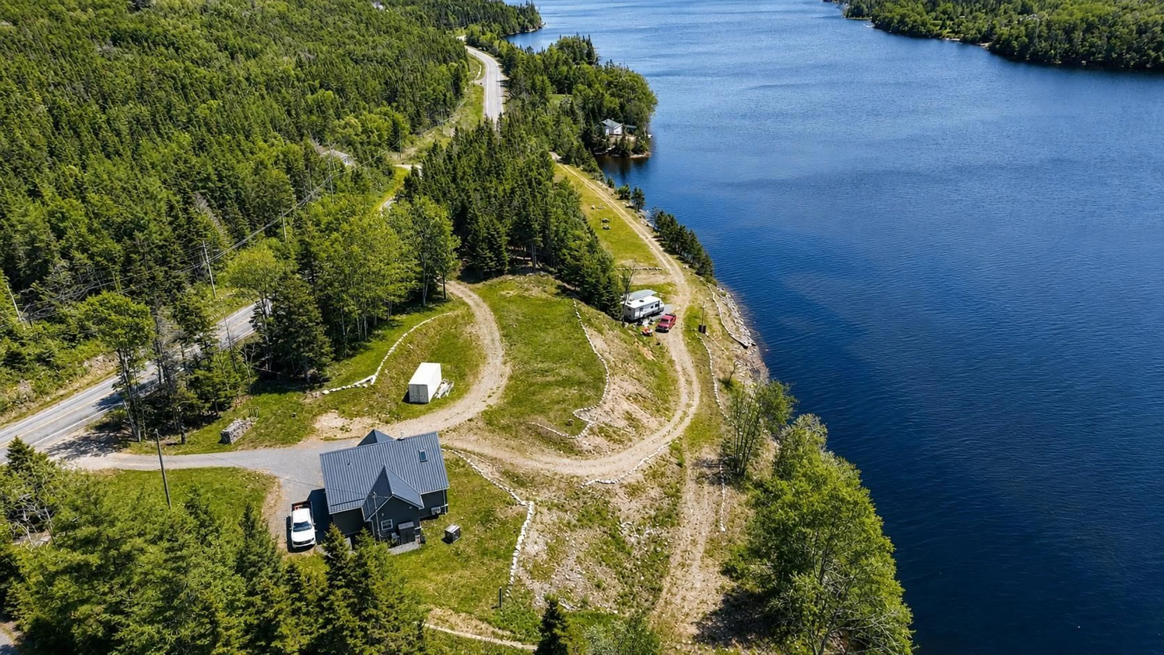 A pic from outside/outdoor area/front of a property/back of a property/a pic from drone, water/lake/river/ocean view for 2100 Hwy 211, Indian Harbour Lake Nova Scotia B0J 3C0