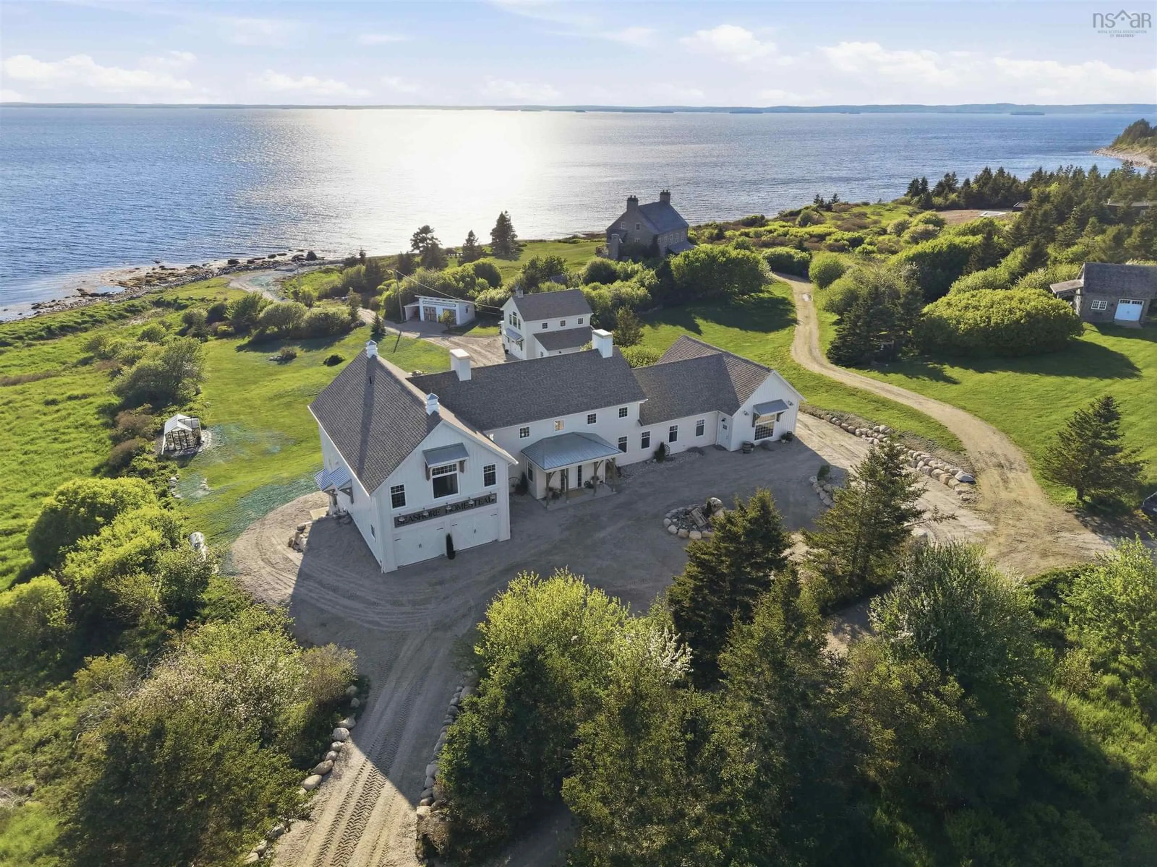 A pic from outside/outdoor area/front of a property/back of a property/a pic from drone, water/lake/river/ocean view for 19 Seashore Lane, Blandford Nova Scotia B0J 1T0