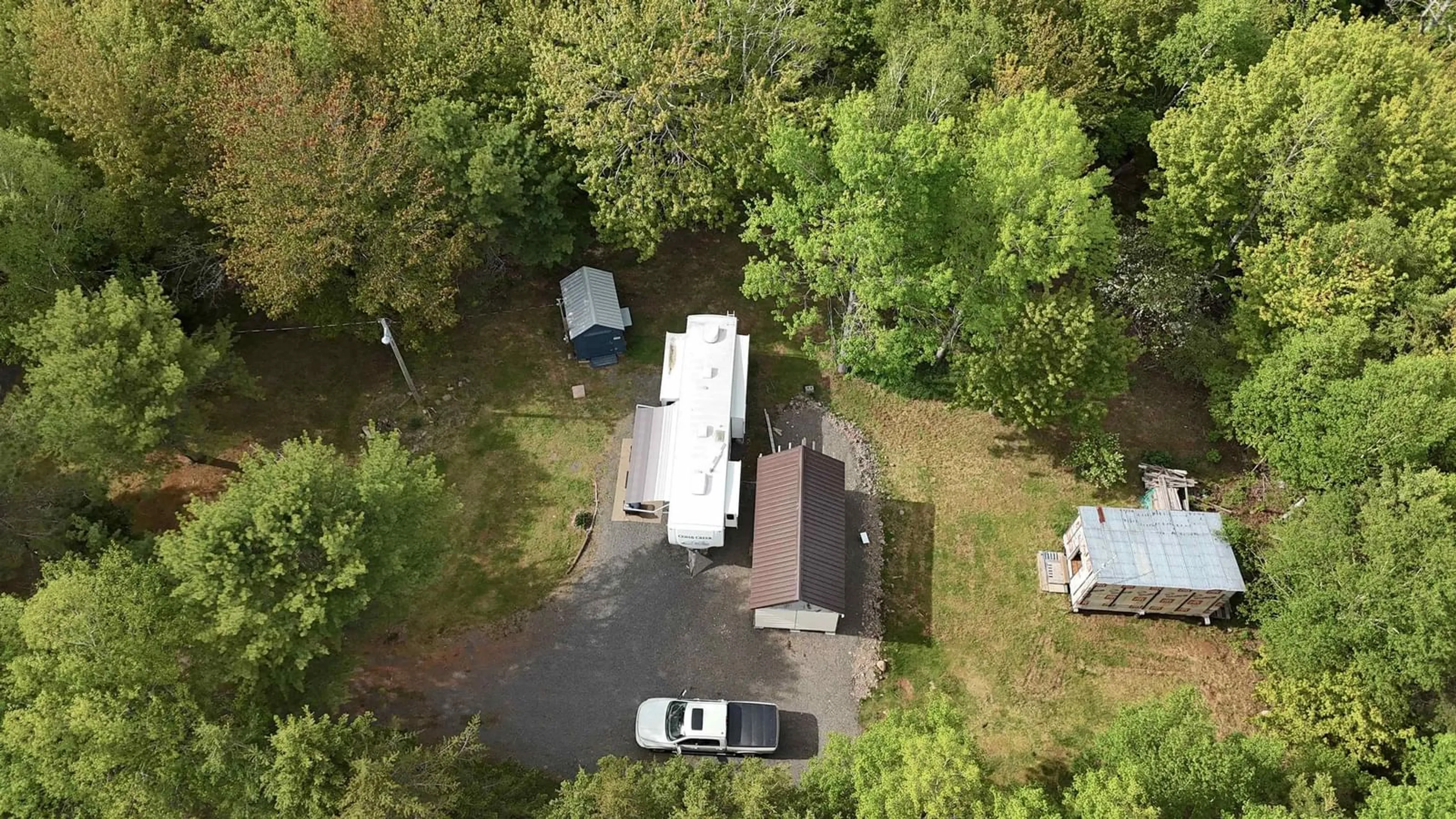 A pic from outside/outdoor area/front of a property/back of a property/a pic from drone, forest/trees view for 15 Bayview Lane, St. Anns Nova Scotia B0E 1B0