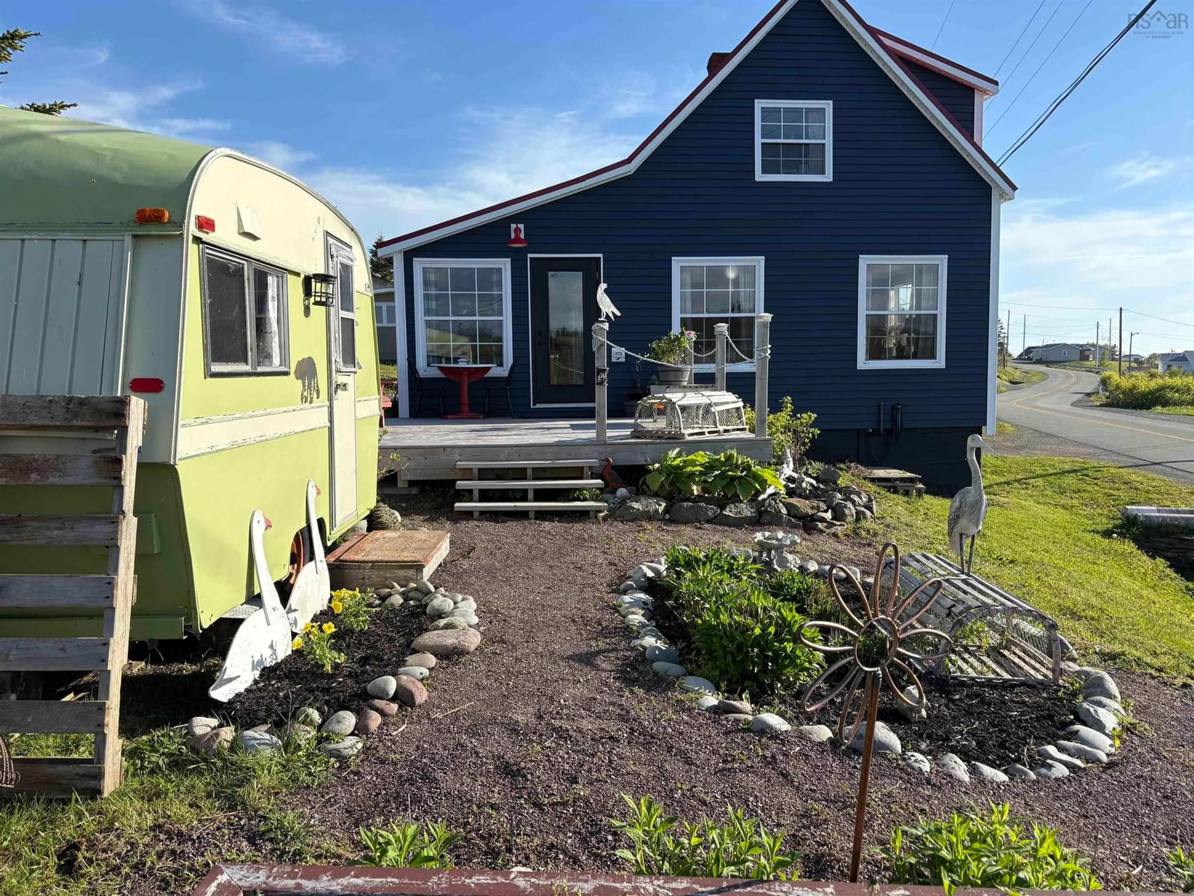 Home with vinyl exterior material, street for 379 South Side Petit De Grat Rd, Alderney Point Nova Scotia B0E 2L0