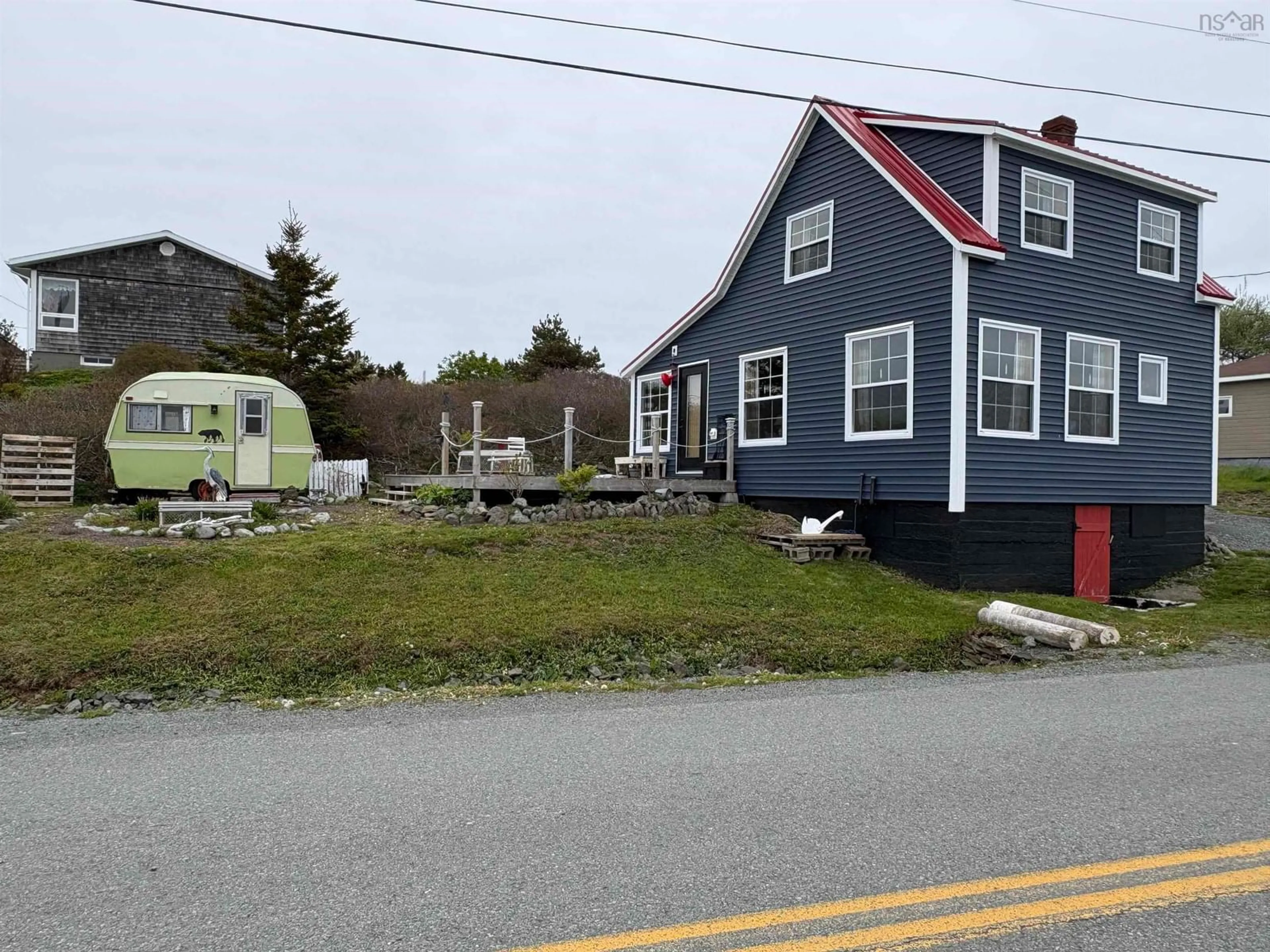 A pic from outside/outdoor area/front of a property/back of a property/a pic from drone, street for 379 South Side Petit De Grat Rd, Alderney Point Nova Scotia B0E 2L0