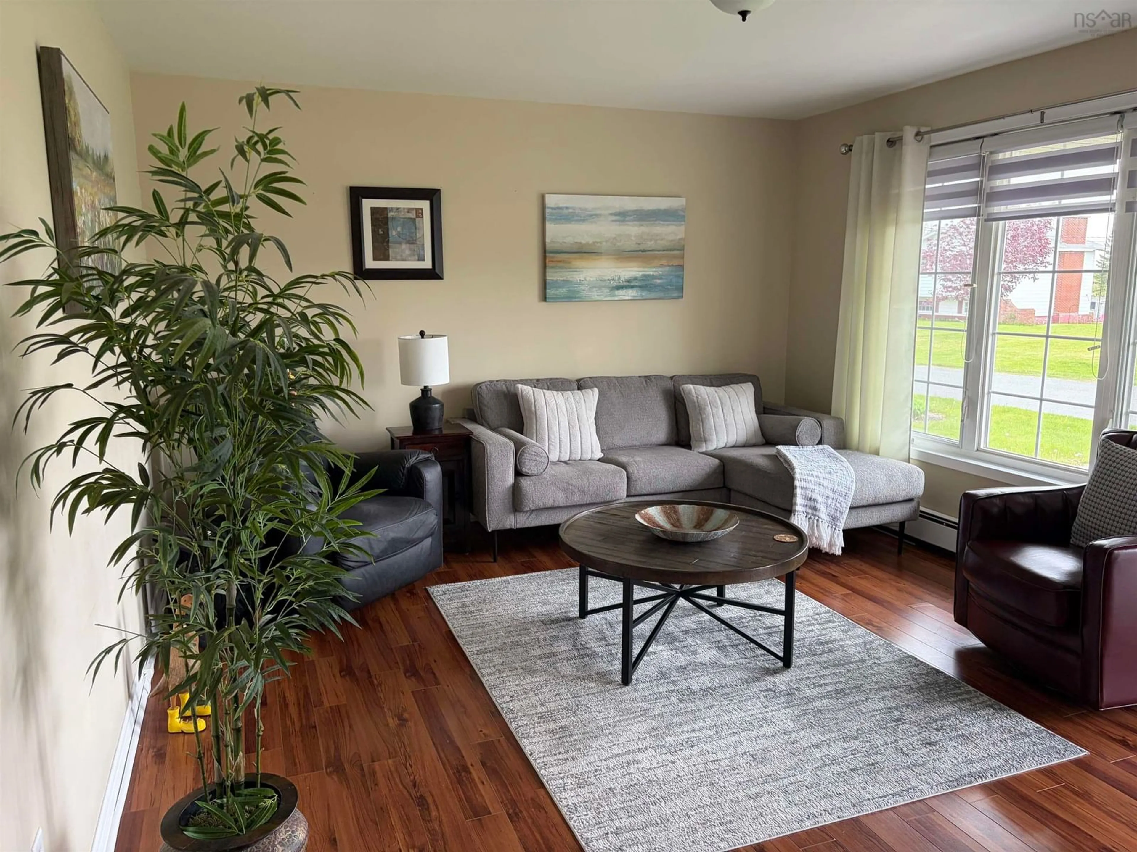 Living room with furniture, wood/laminate floor for 14 Drew St, Glace Bay Nova Scotia B1A 1A7