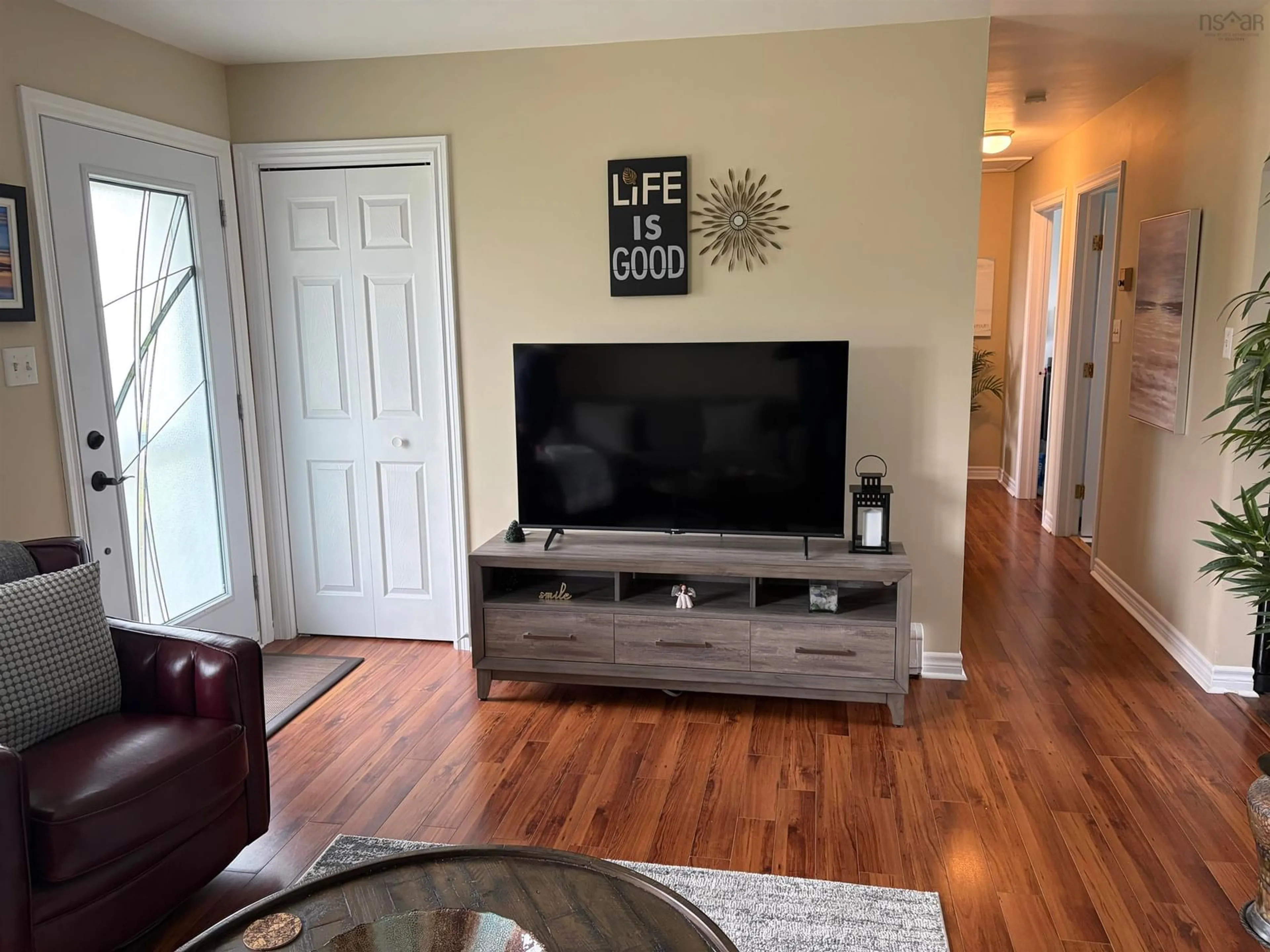Living room with furniture, wood/laminate floor for 14 Drew St, Glace Bay Nova Scotia B1A 1A7