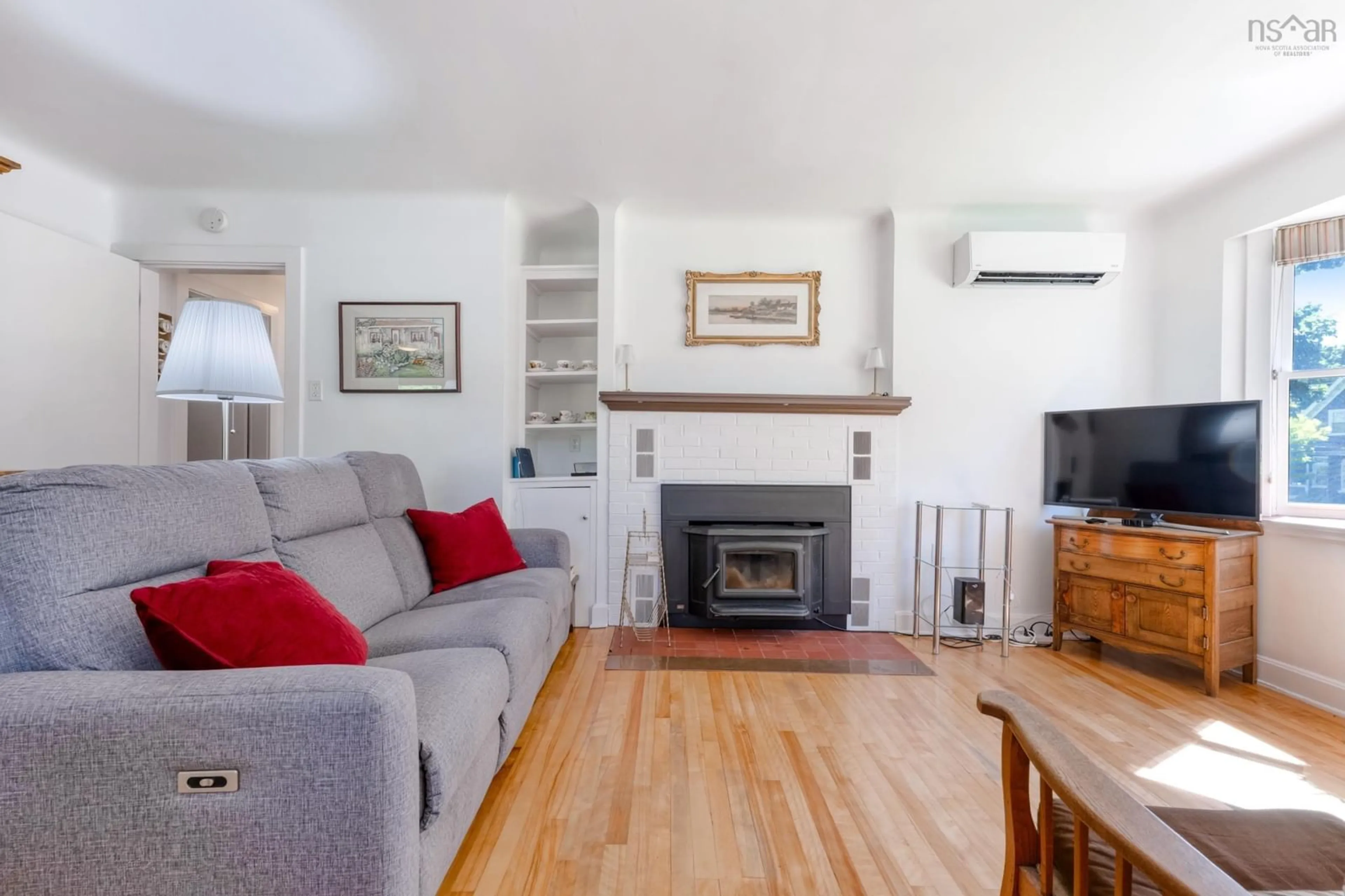 Living room with furniture, wood/laminate floor for 90 Crescent St, Bridgewater Nova Scotia B4V 2C7