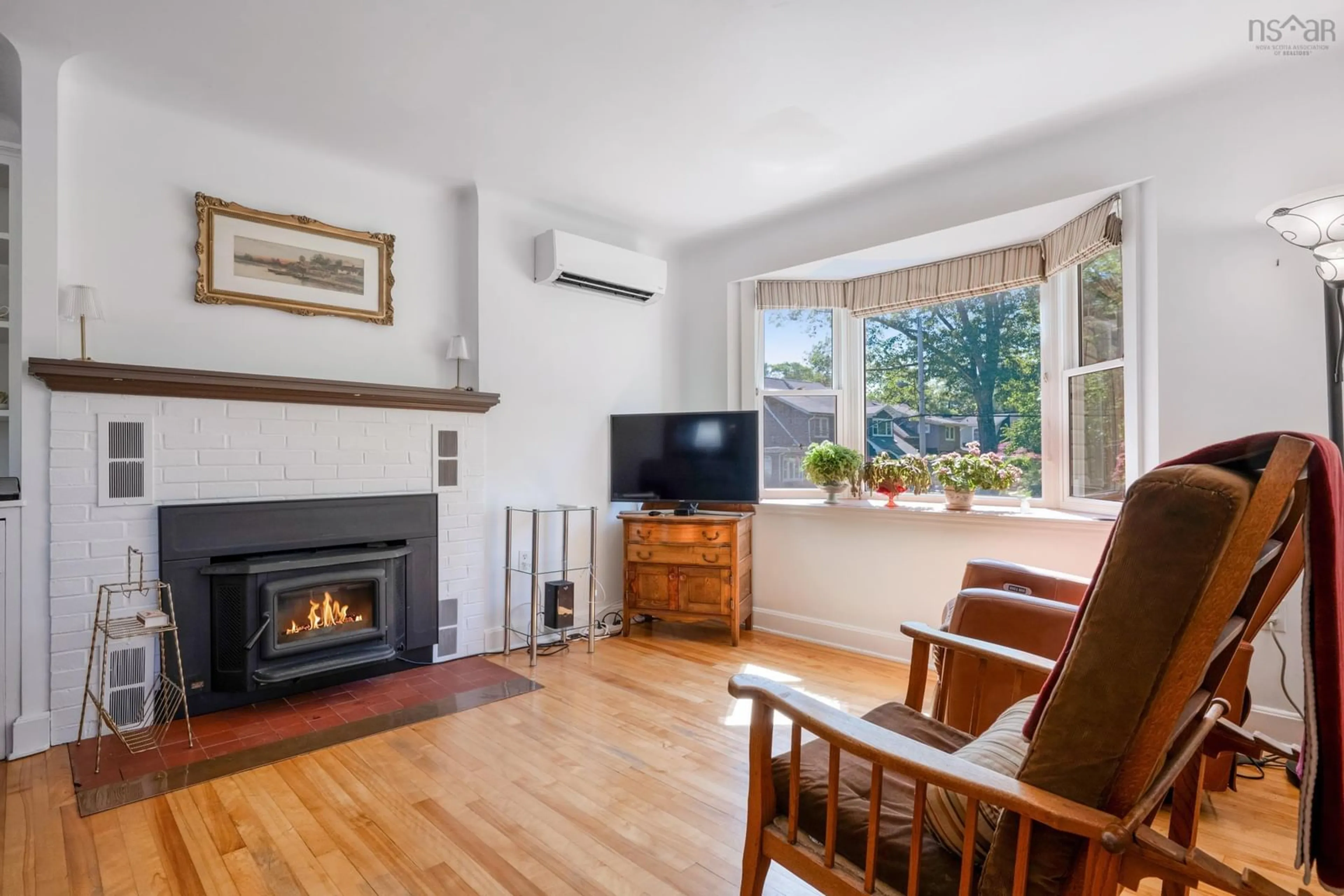 Living room with furniture, wood/laminate floor for 90 Crescent St, Bridgewater Nova Scotia B4V 2C7