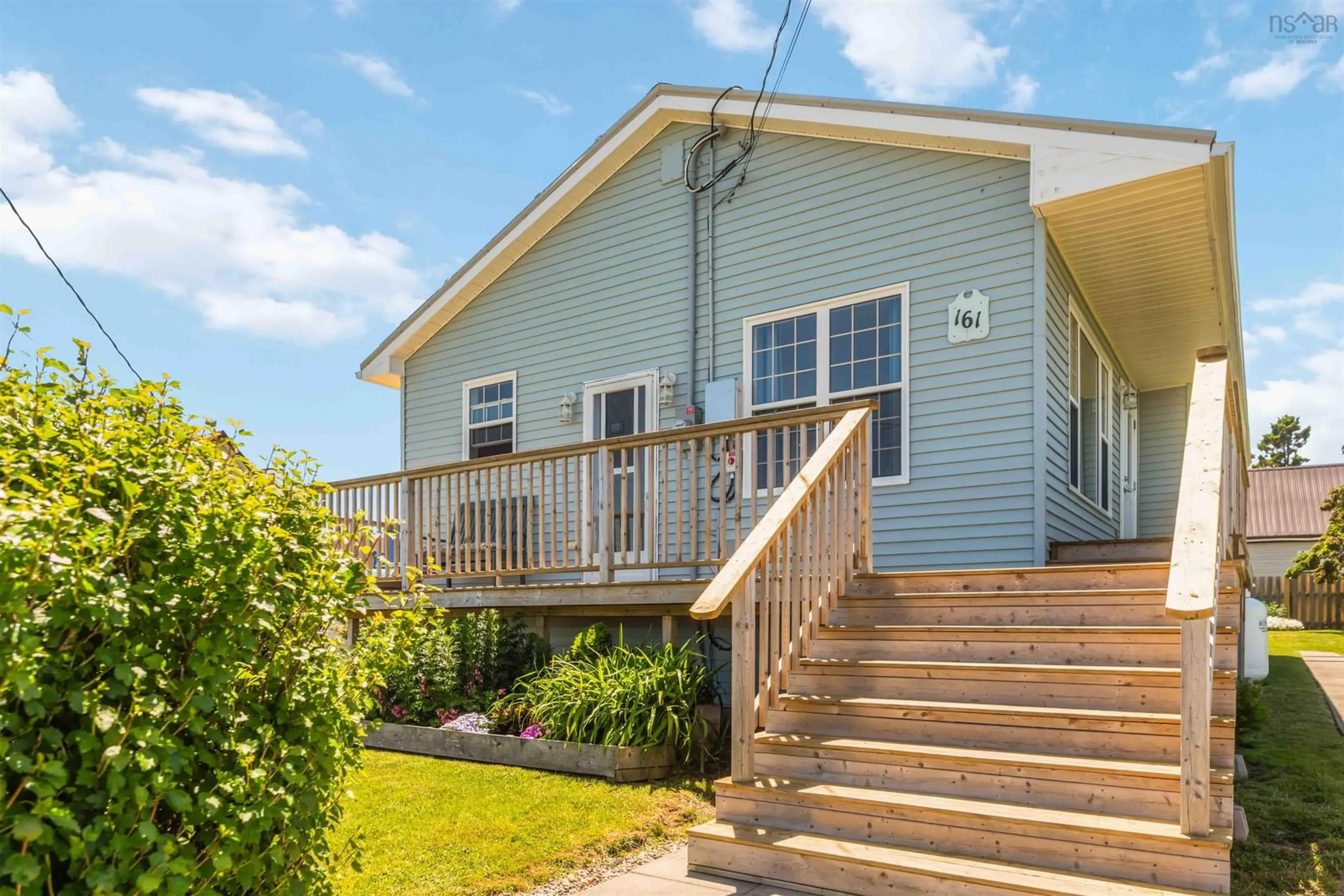 Home with vinyl exterior material, street for 161 Water St, Westport Nova Scotia B0V 1H0
