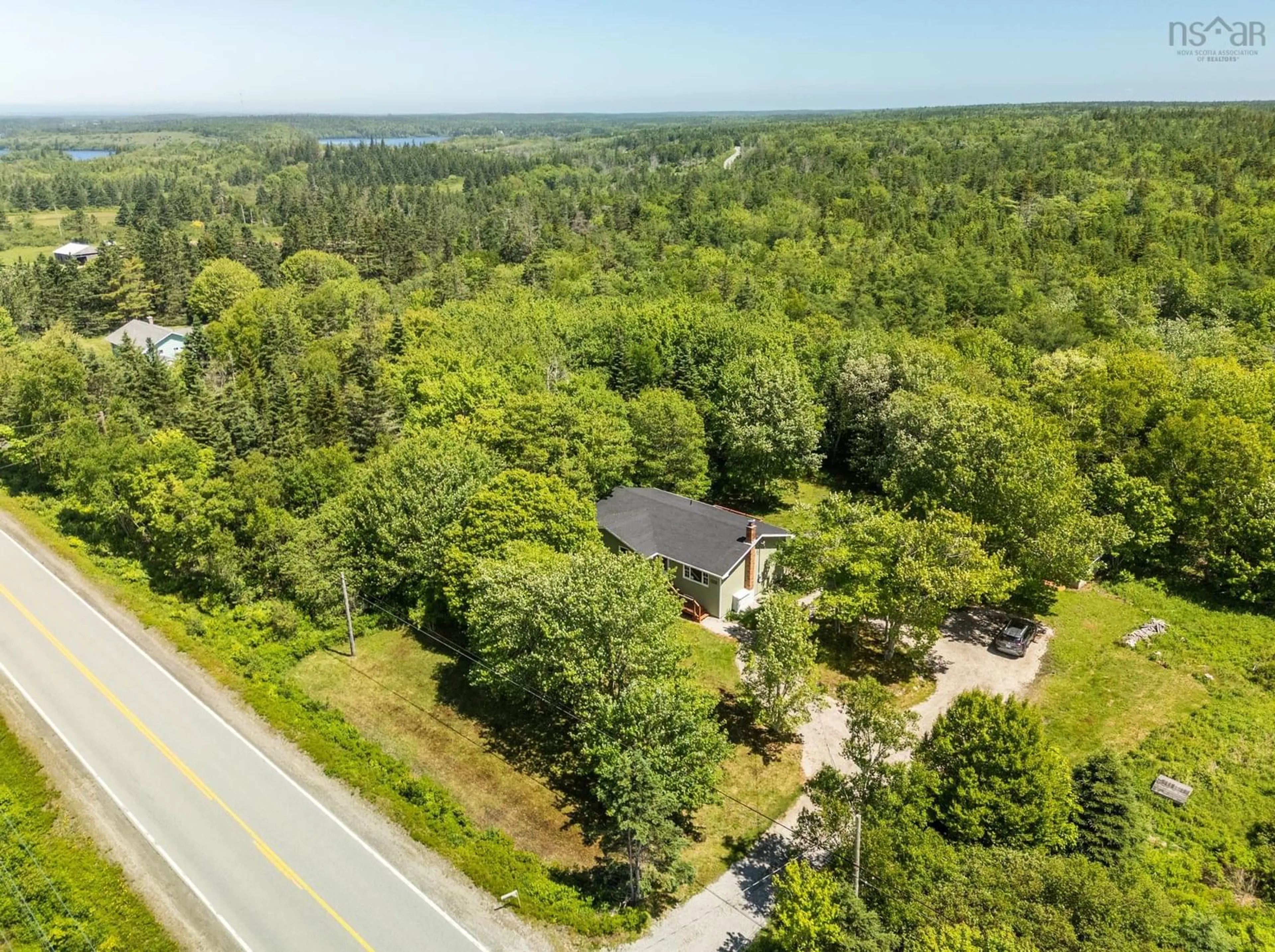 A pic from outside/outdoor area/front of a property/back of a property/a pic from drone, forest/trees view for 2350 Highway 1, Wellington Nova Scotia B5A 5A8