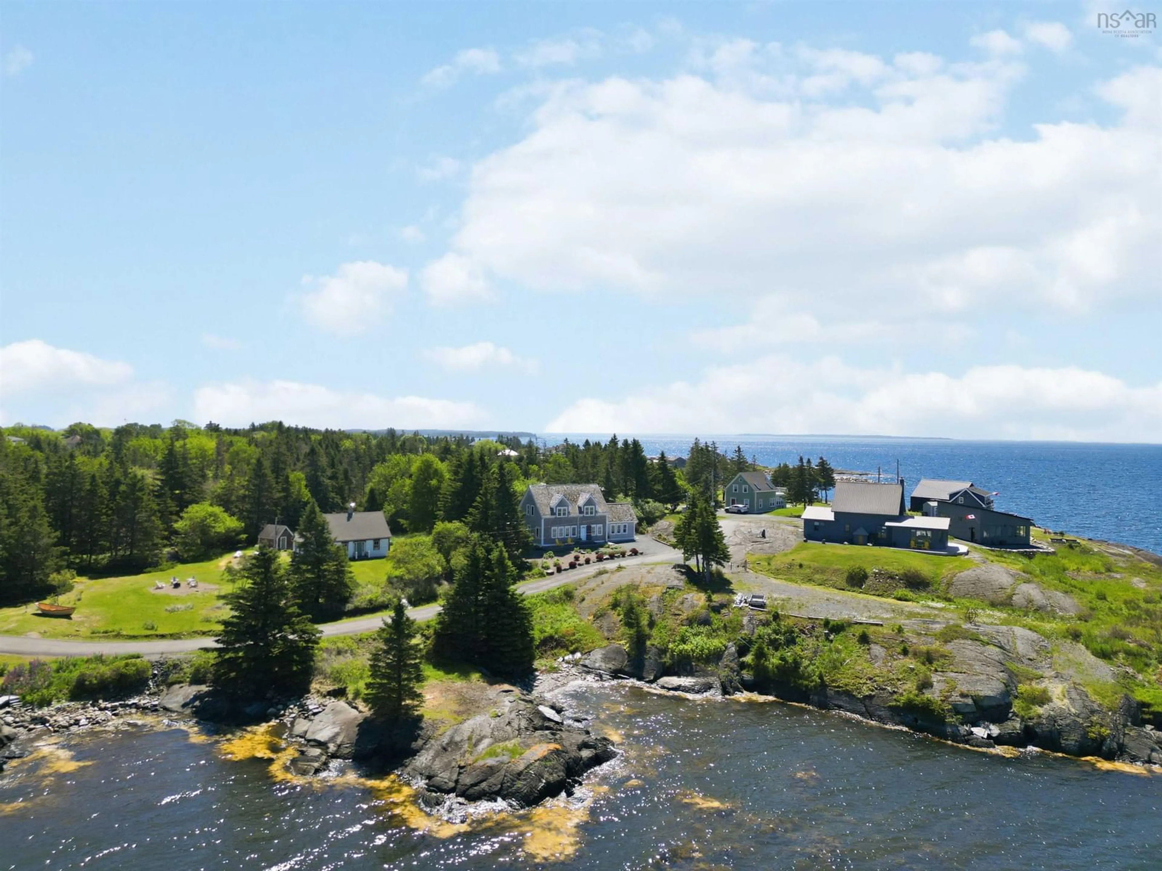 A pic from outside/outdoor area/front of a property/back of a property/a pic from drone, water/lake/river/ocean view for 29 Herring Rock Rd, Blue Rocks Nova Scotia B0J 2C0