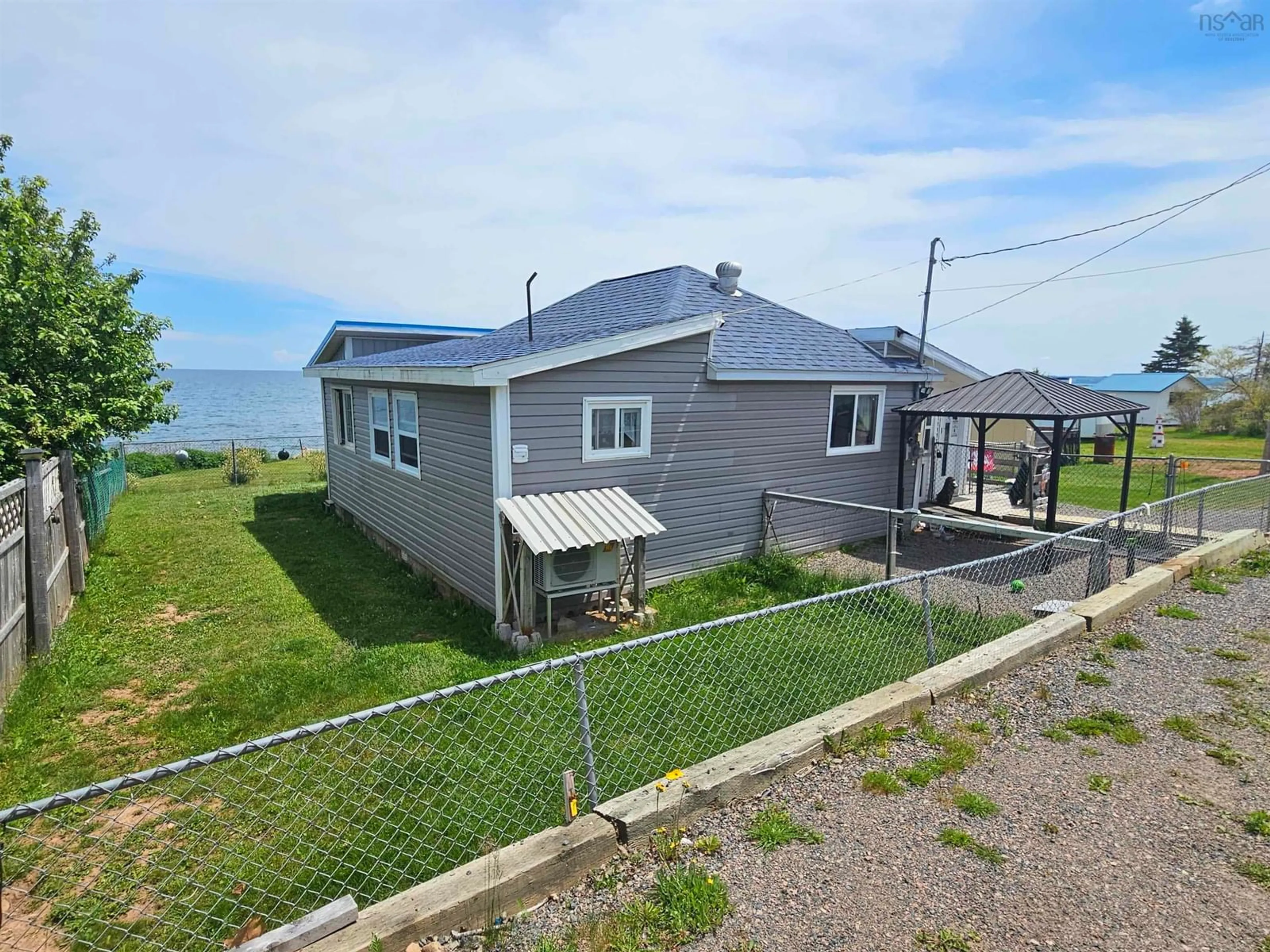 A pic from outside/outdoor area/front of a property/back of a property/a pic from drone, water/lake/river/ocean view for 402 Smith Point Rd, Fox Harbour Nova Scotia B0K 1Y0