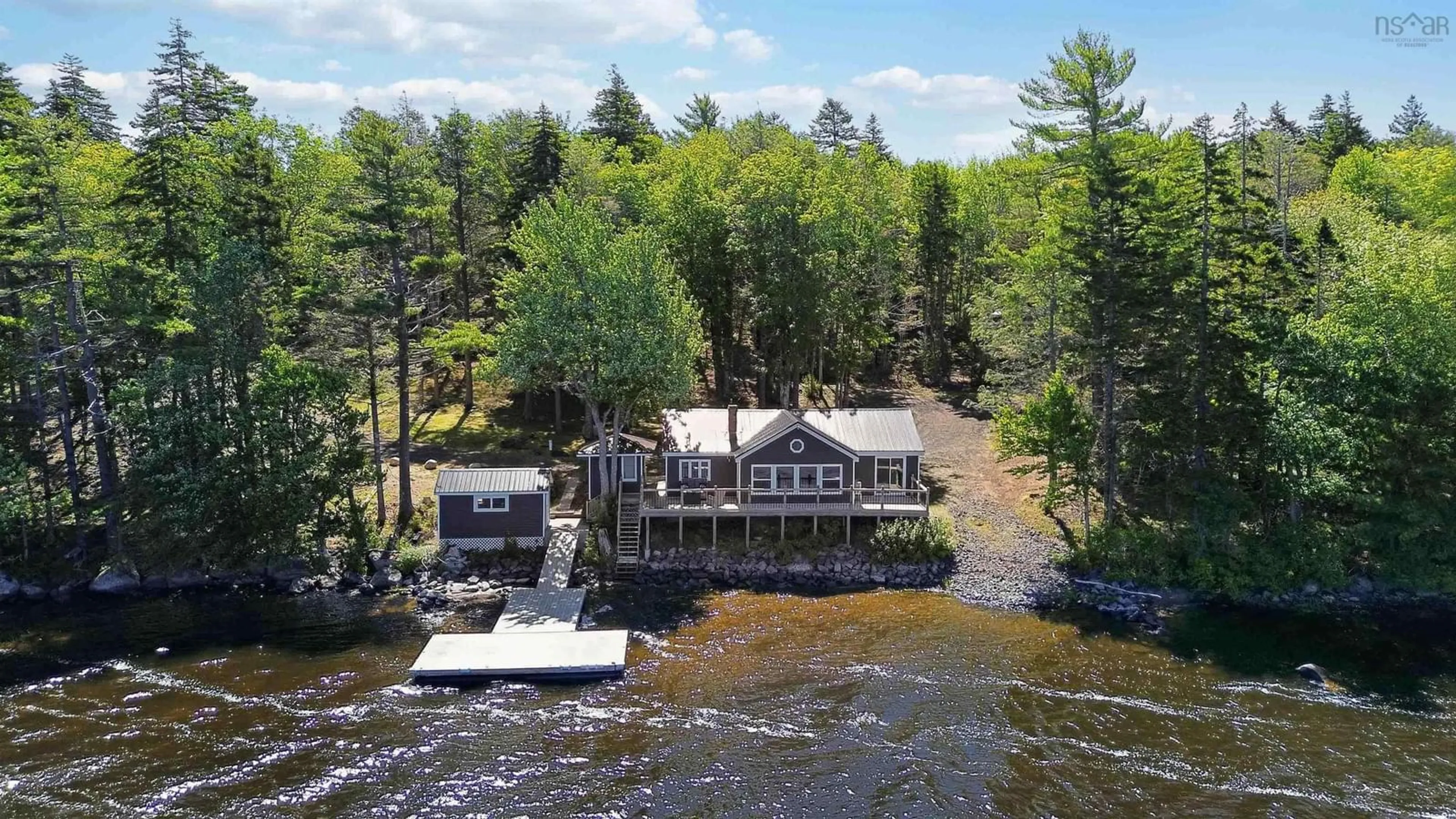 A pic from outside/outdoor area/front of a property/back of a property/a pic from drone, water/lake/river/ocean view for 31 Lake Shore Dr, North Range Nova Scotia B0W 1H0