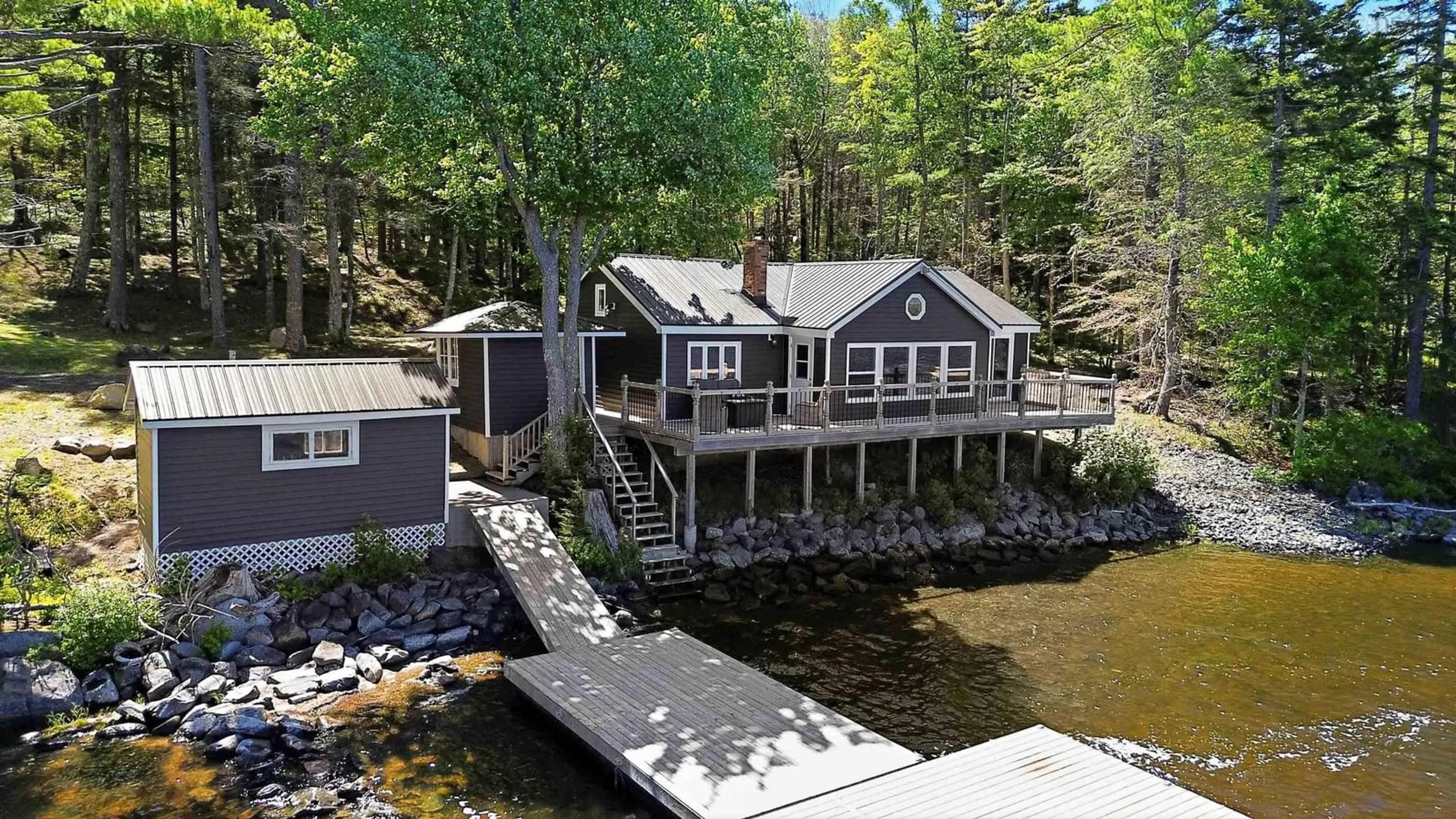 A pic from outside/outdoor area/front of a property/back of a property/a pic from drone, water/lake/river/ocean view for 31 Lake Shore Dr, North Range Nova Scotia B0W 1H0