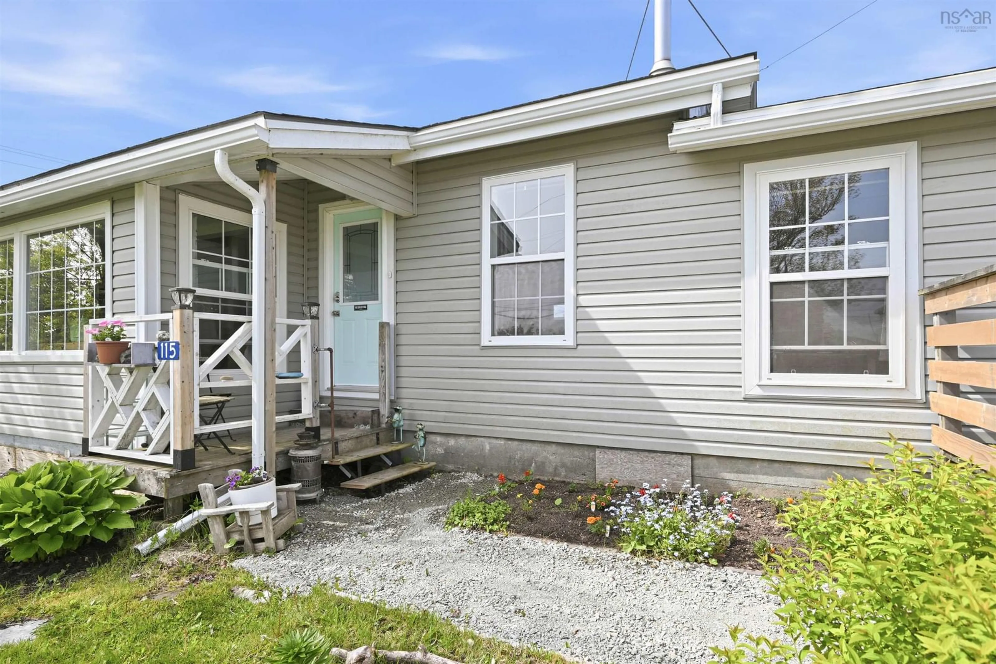 Home with vinyl exterior material, street for 115 Sandy Cove Rd, Terence Bay Nova Scotia B3T 1Y4