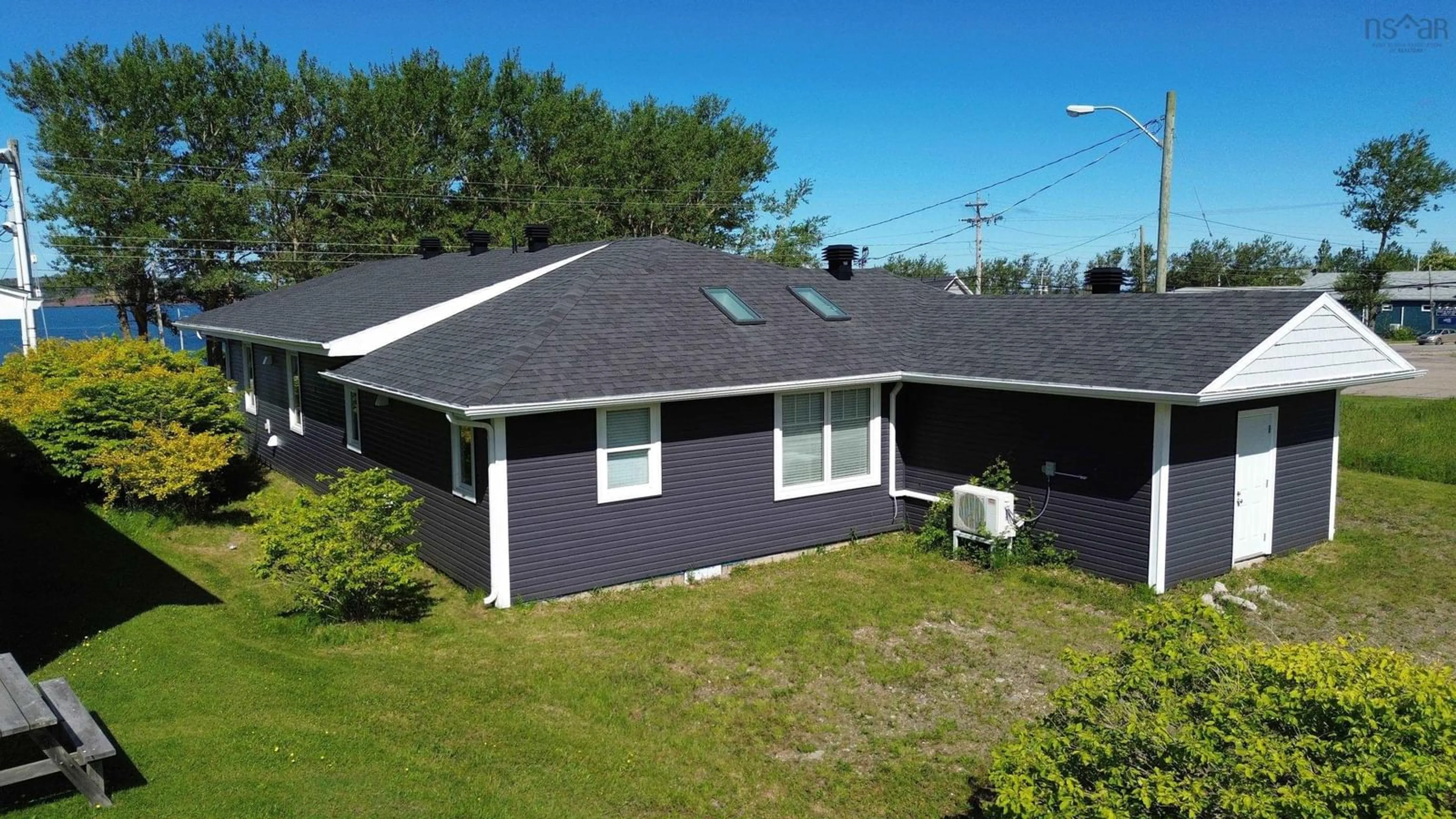 A pic from outside/outdoor area/front of a property/back of a property/a pic from drone, street for 136 Main St, Port Hood Nova Scotia B0E 2W0