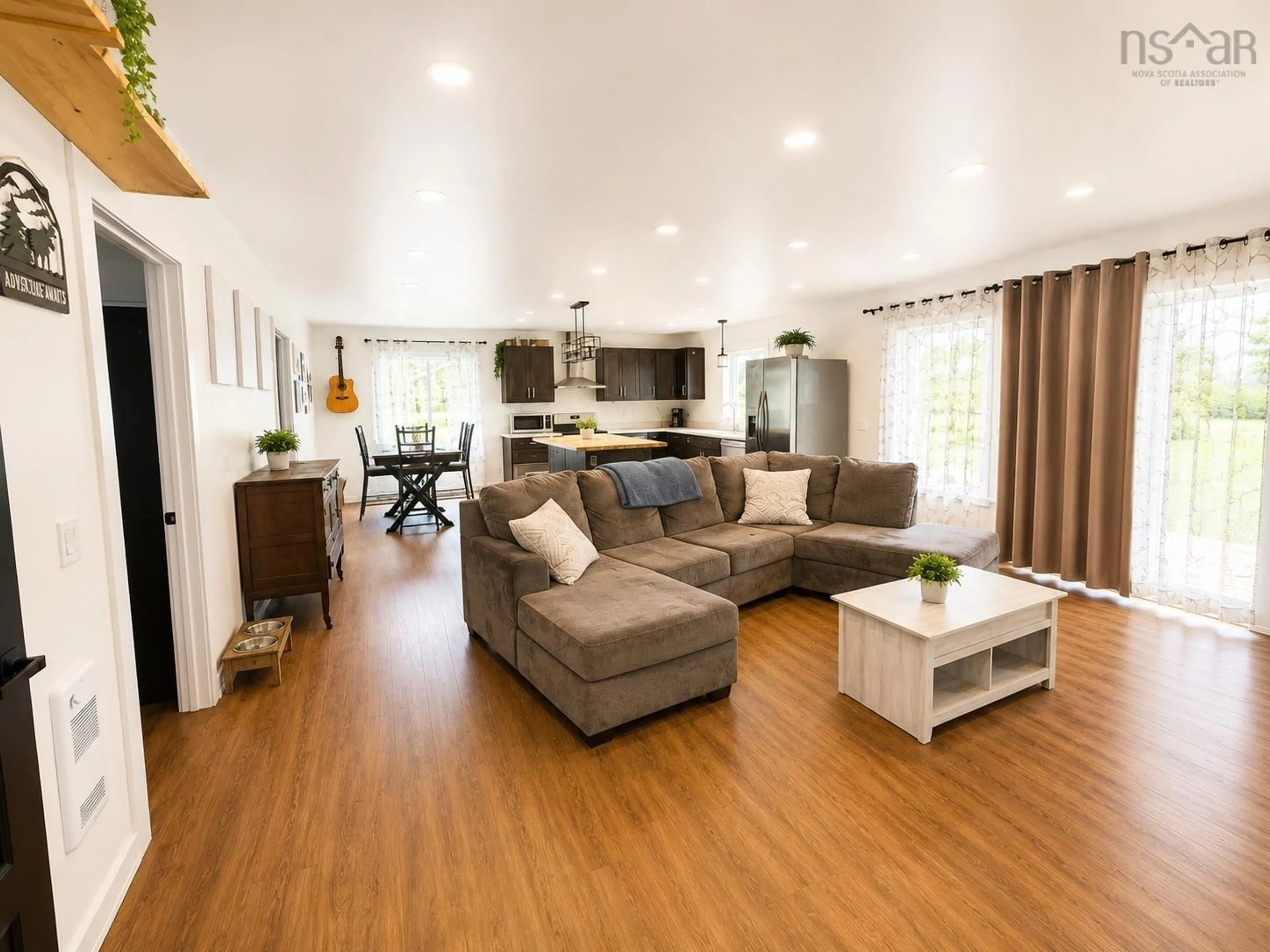 Living room with furniture, wood/laminate floor for 90 Boudreauville Rd, Boudreauville Nova Scotia B0E 2L0