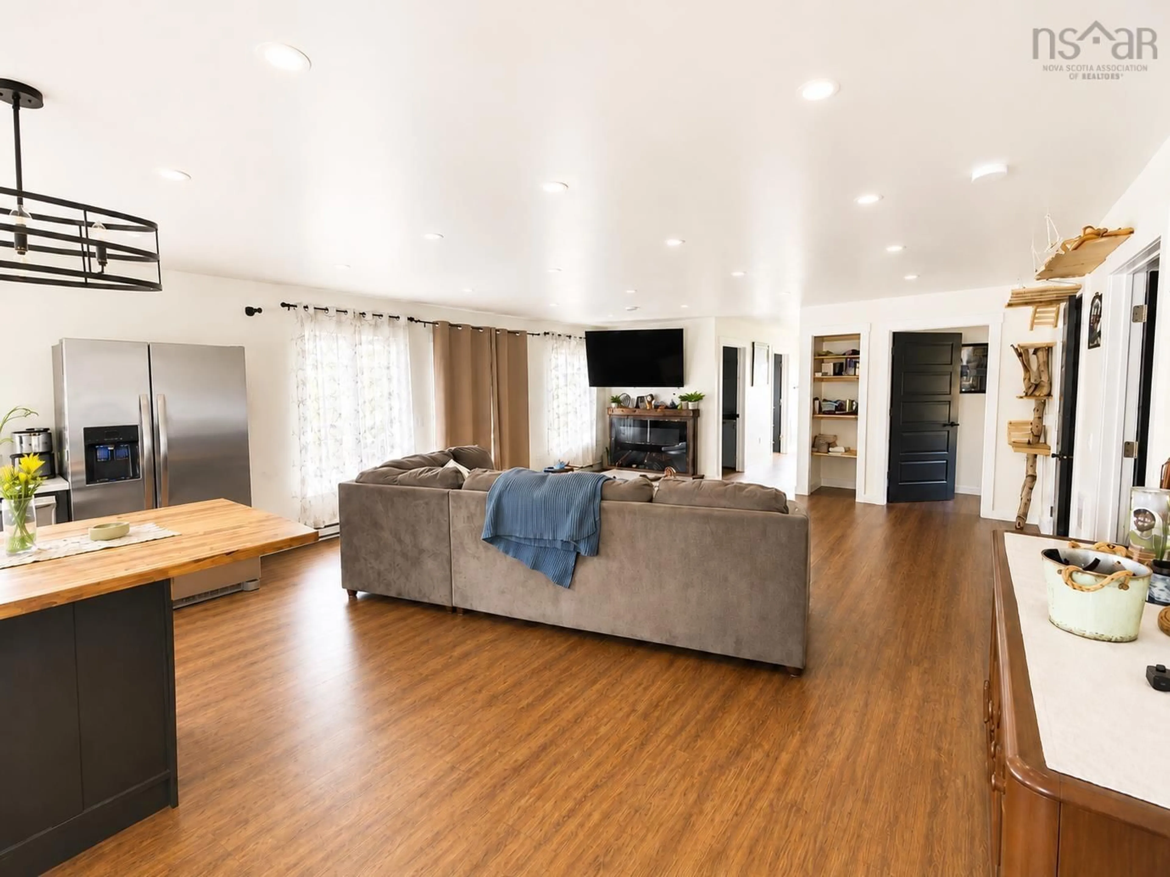 Living room with furniture, wood/laminate floor for 90 Boudreauville Rd, Boudreauville Nova Scotia B0E 2L0