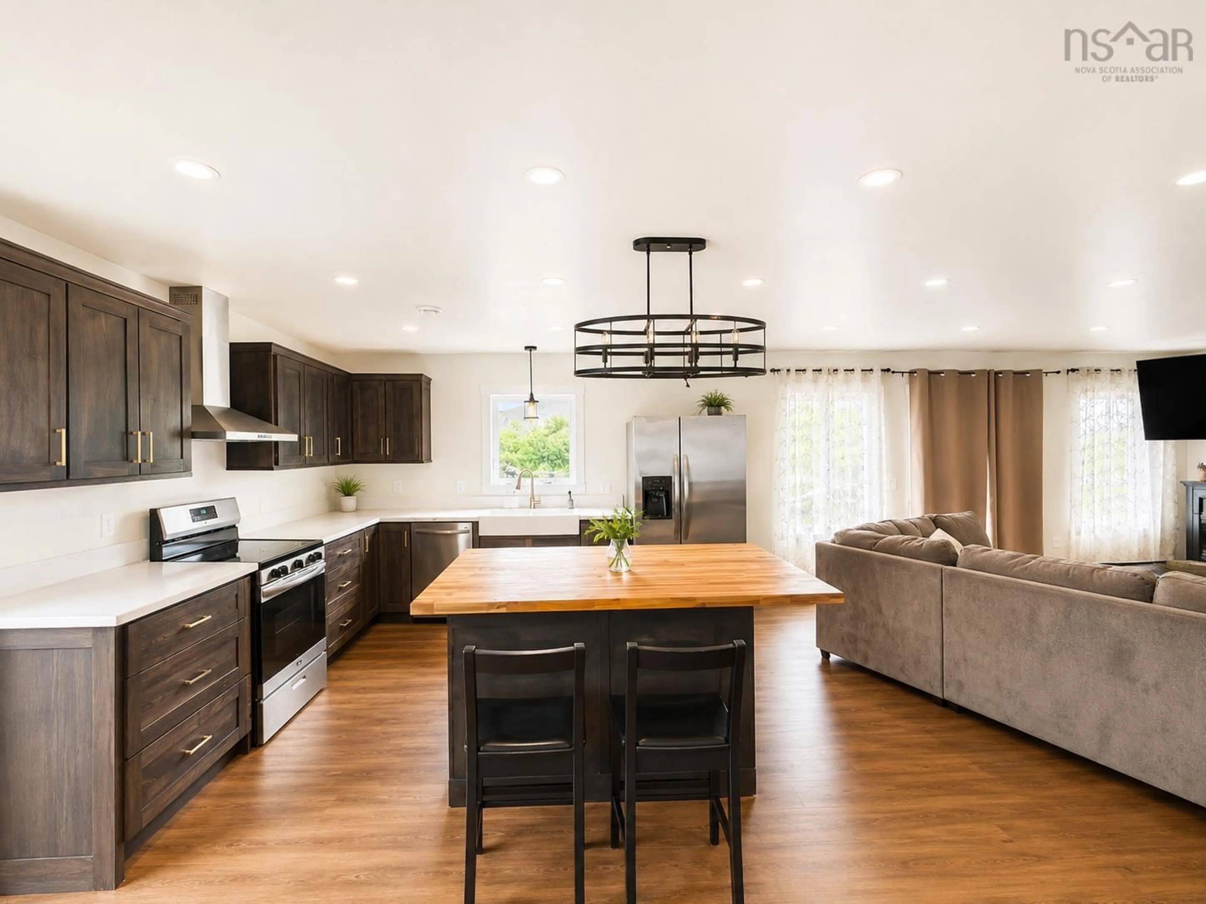 Open concept kitchen, wood/laminate floor for 90 Boudreauville Rd, Boudreauville Nova Scotia B0E 2L0