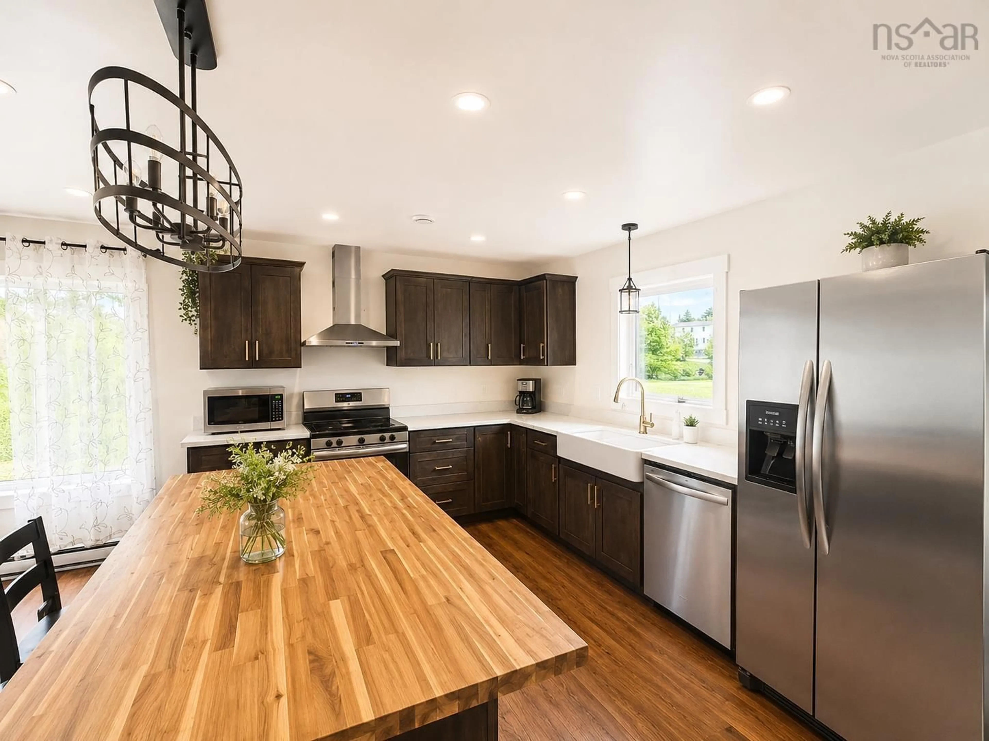 Open concept kitchen, wood/laminate floor for 90 Boudreauville Rd, Boudreauville Nova Scotia B0E 2L0