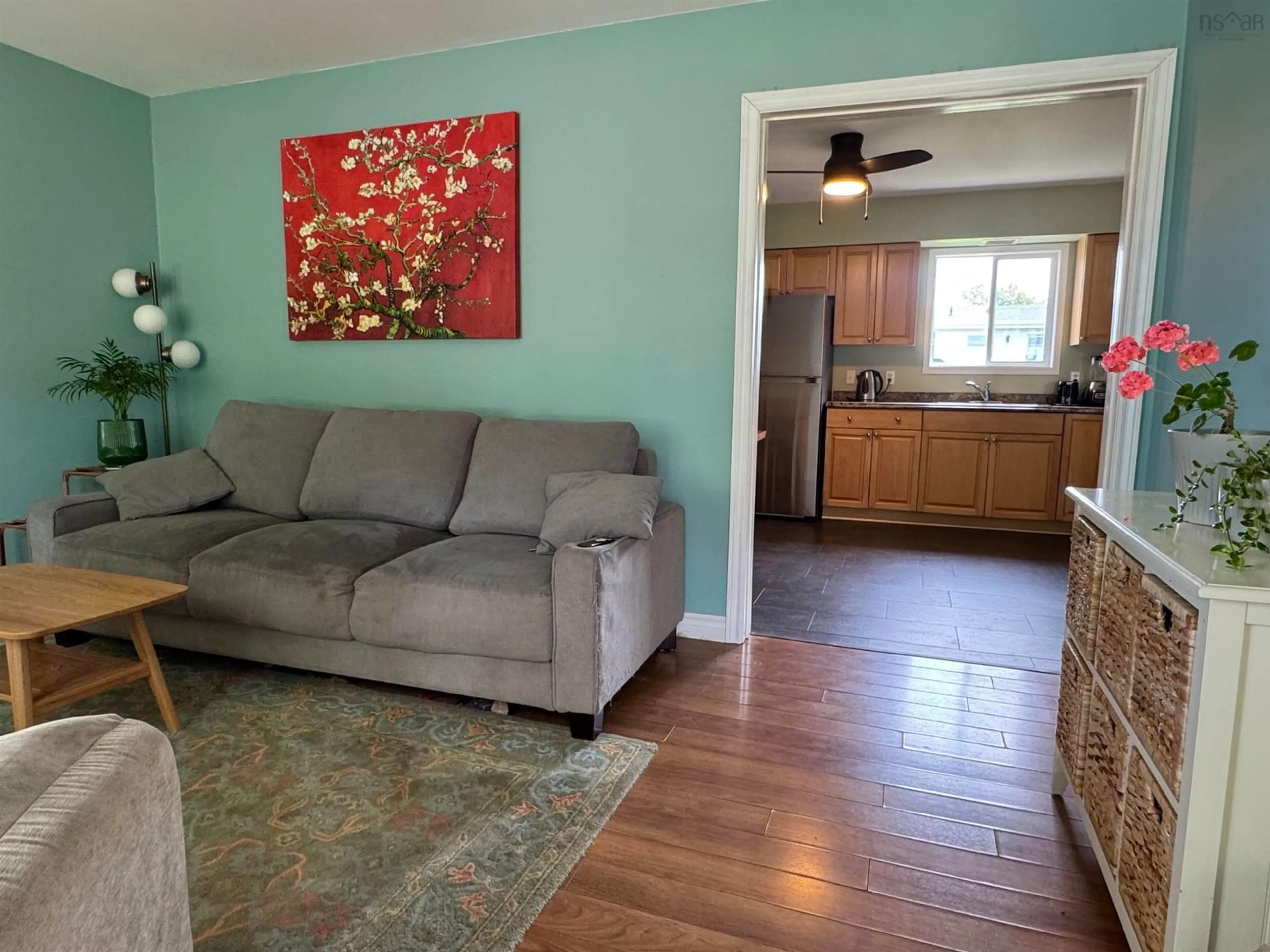 Living room with furniture, wood/laminate floor for 12 Don-Gordon Street St, Glace Bay Nova Scotia B1A 6A2