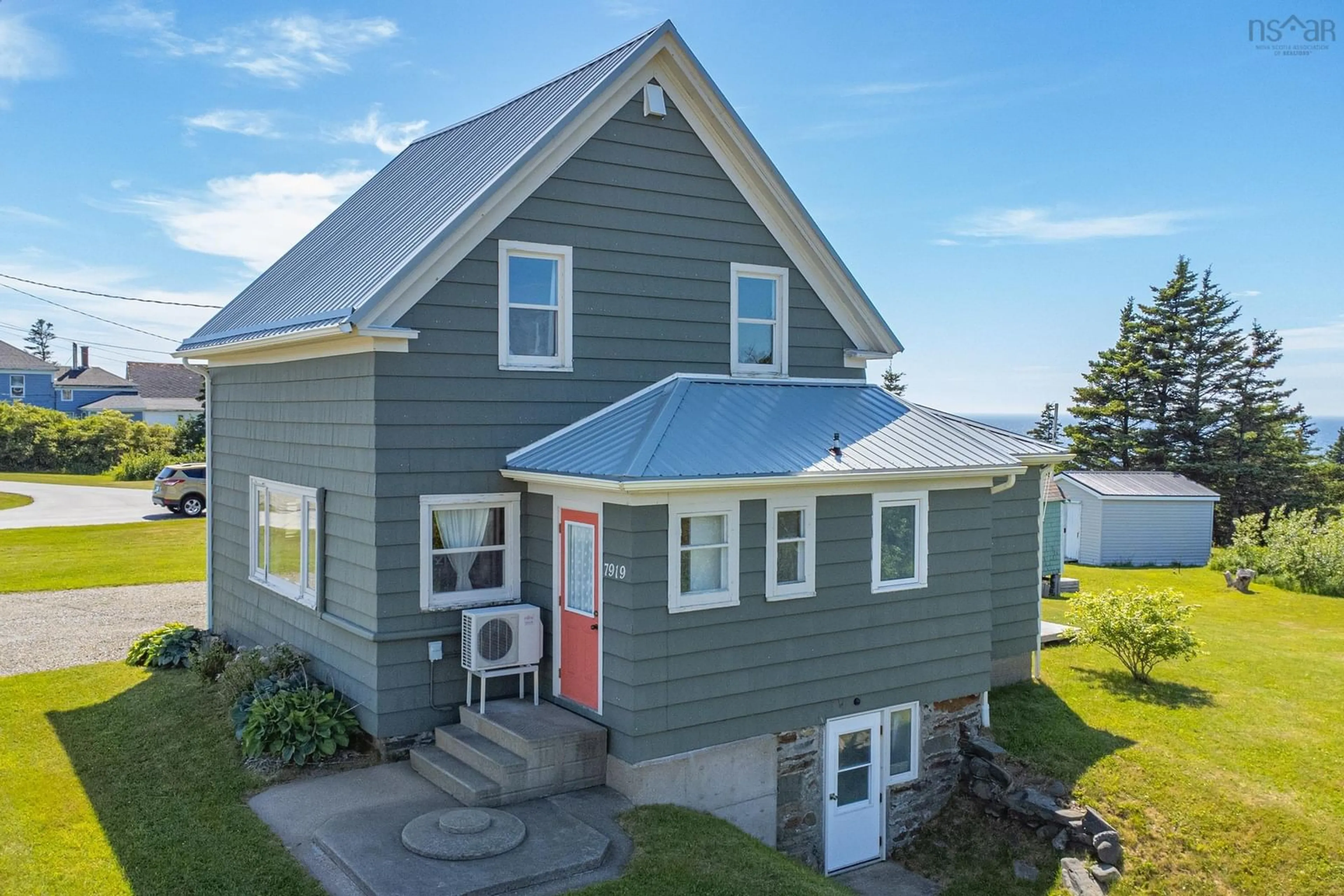 A pic from outside/outdoor area/front of a property/back of a property/a pic from drone, street for 7919 Highway 1, Meteghan Nova Scotia B0W 2J0