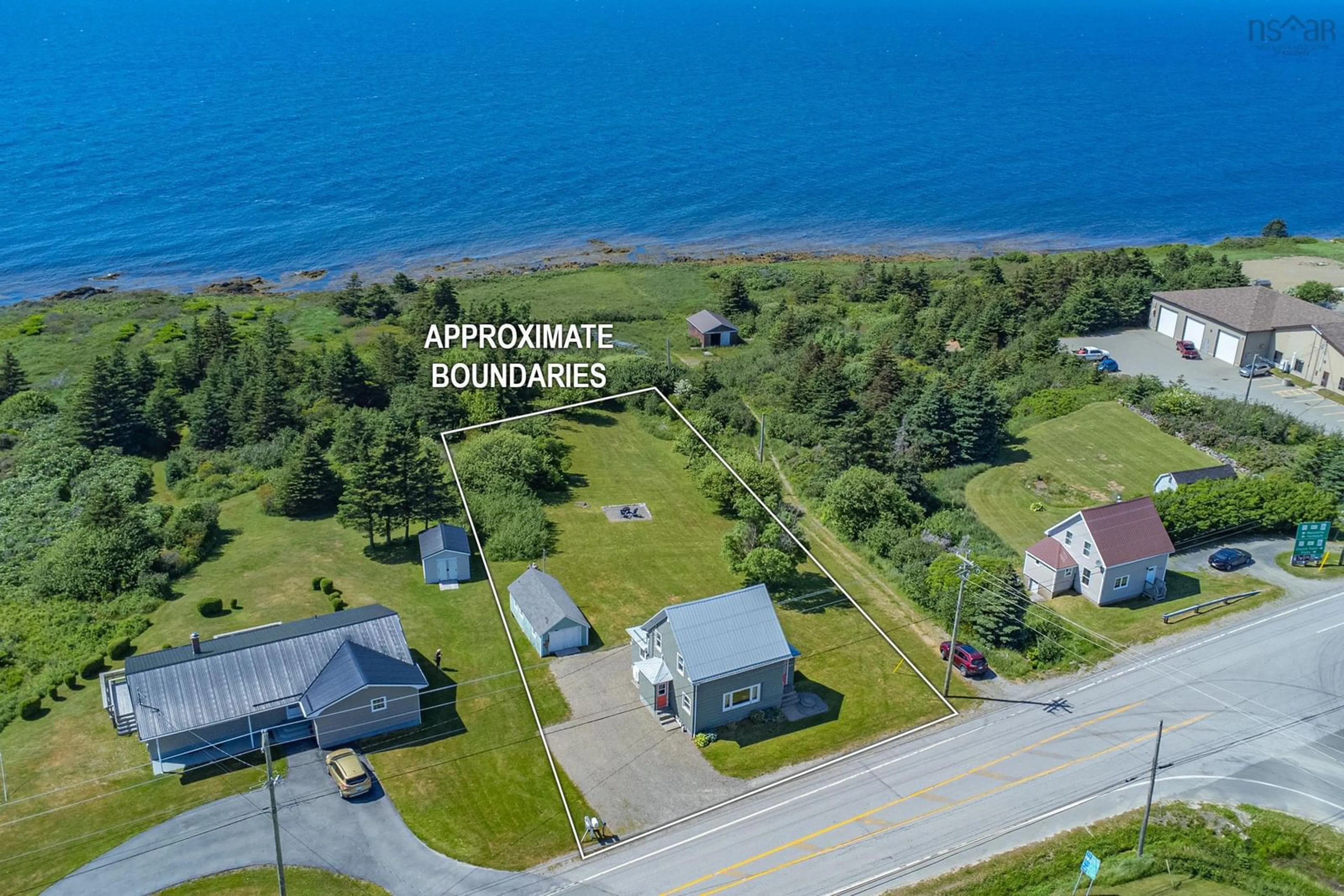 A pic from outside/outdoor area/front of a property/back of a property/a pic from drone, water/lake/river/ocean view for 7919 Highway 1, Meteghan Nova Scotia B0W 2J0