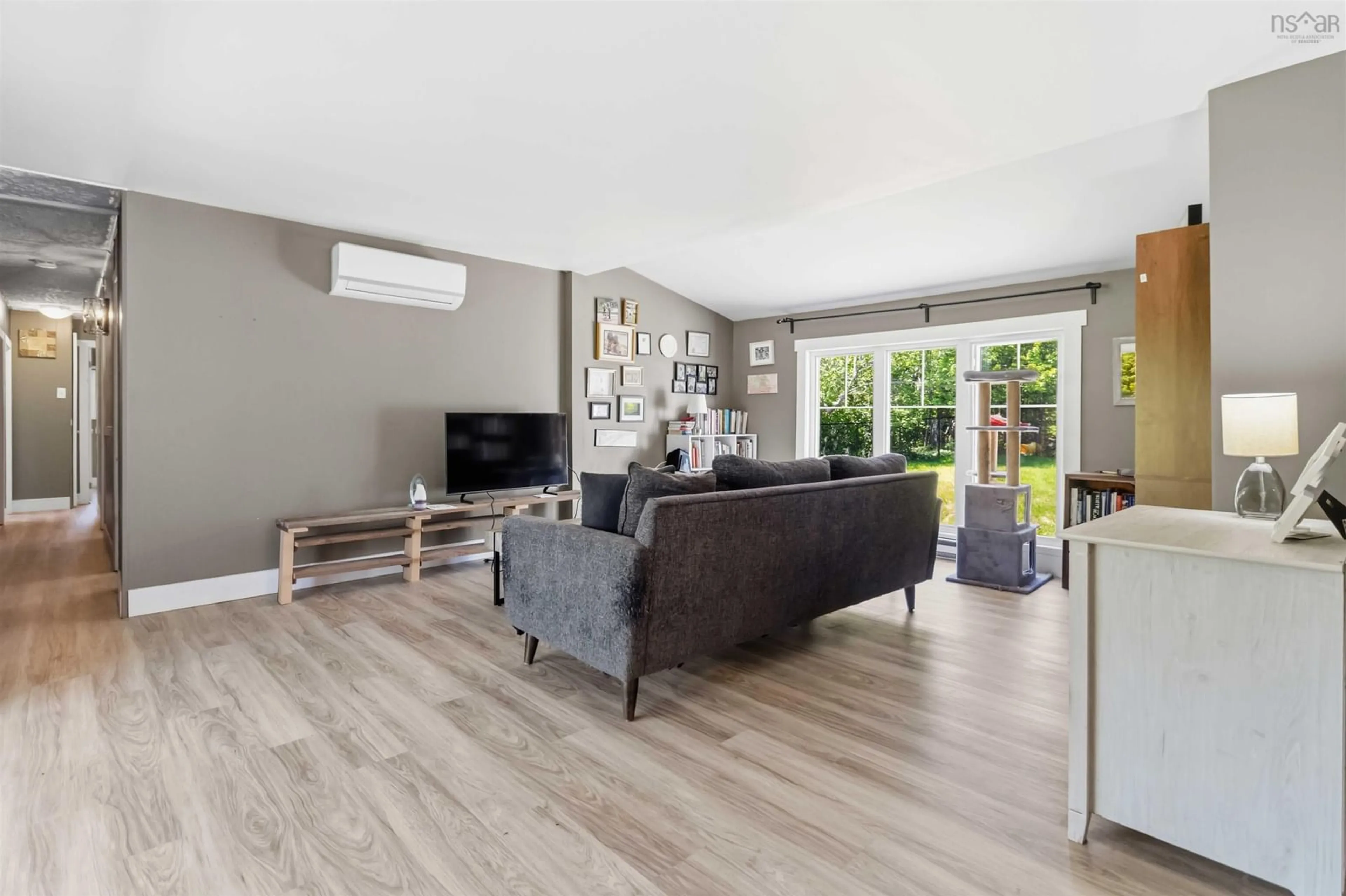 Living room with furniture, wood/laminate floor for 319 Brookside Rd, Brookside Nova Scotia B3T 1T2
