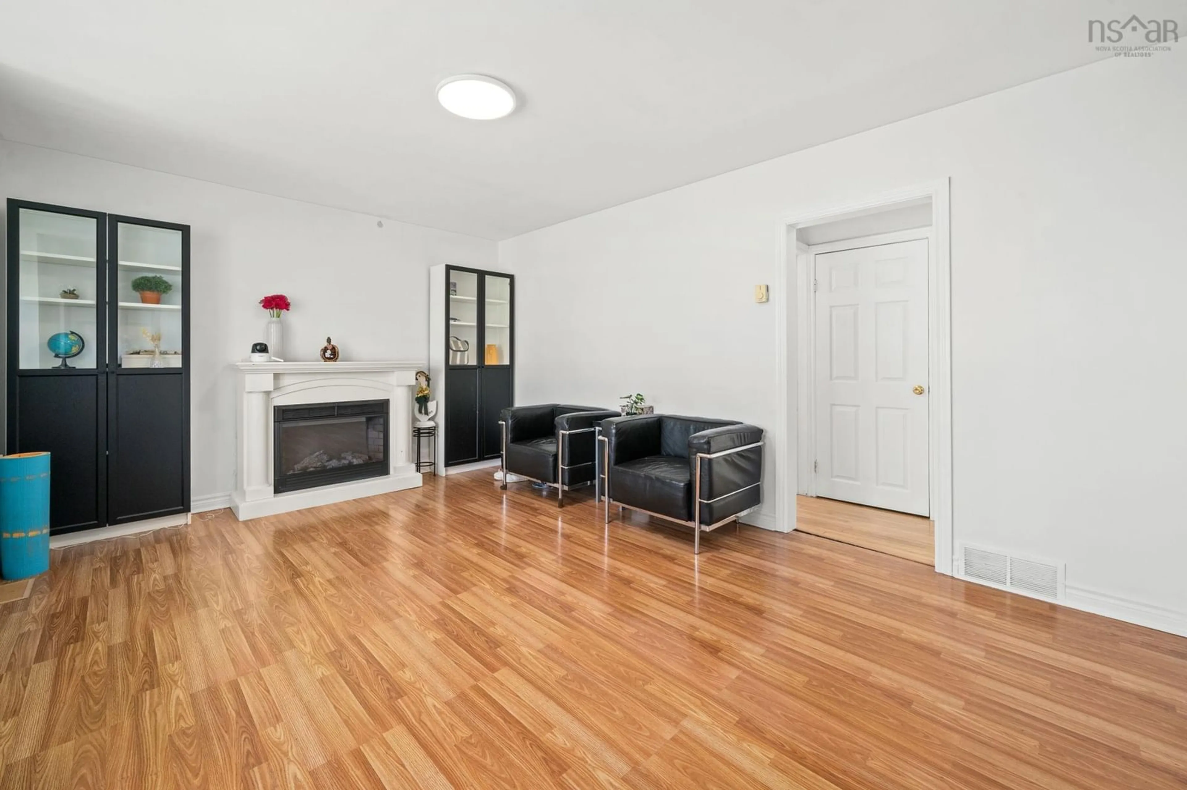 Living room with furniture, wood/laminate floor for 18 Avon Crescent, Spryfield Nova Scotia B3R 2E3