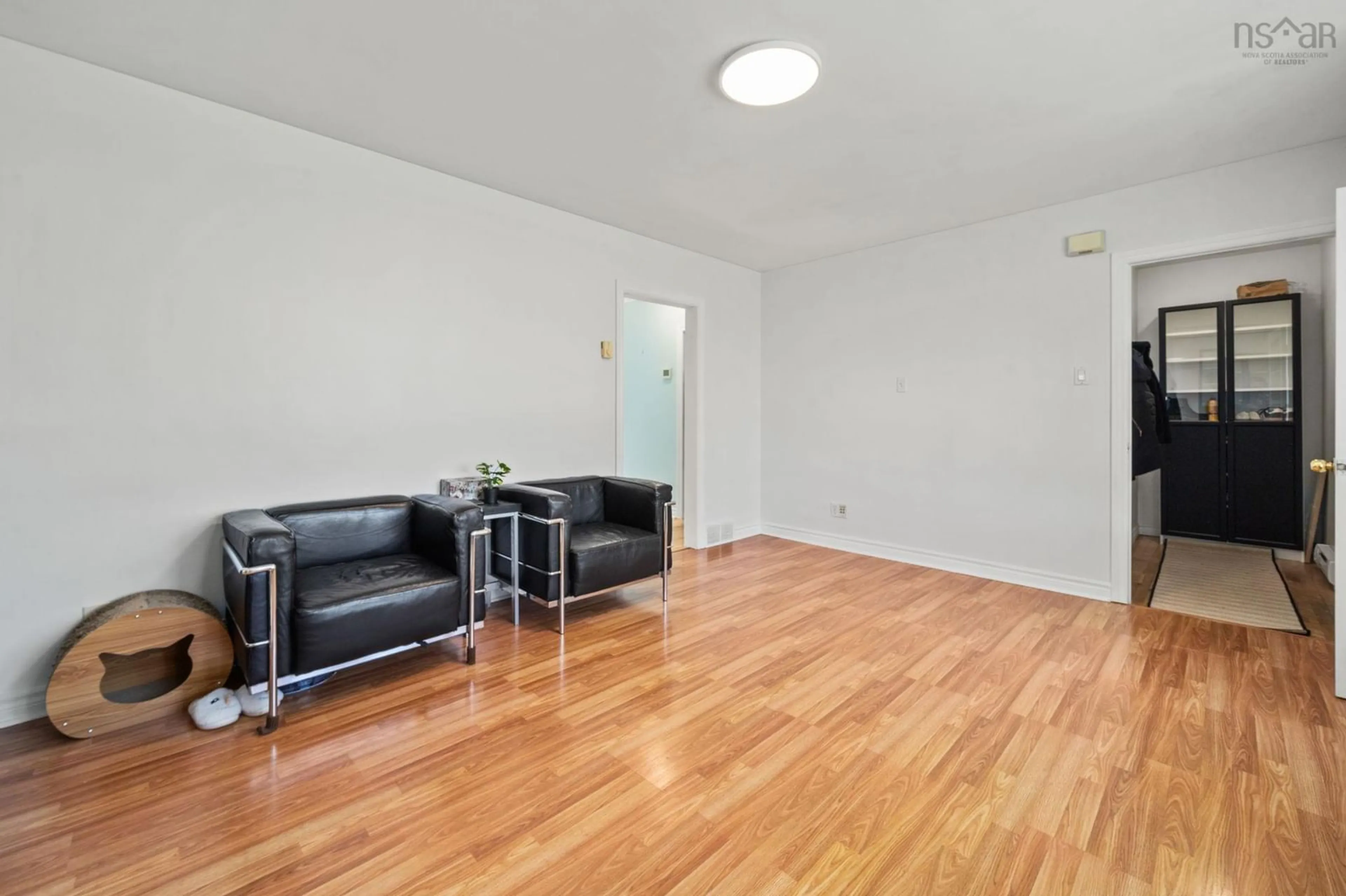 Living room with furniture, wood/laminate floor for 18 Avon Crescent, Spryfield Nova Scotia B3R 2E3