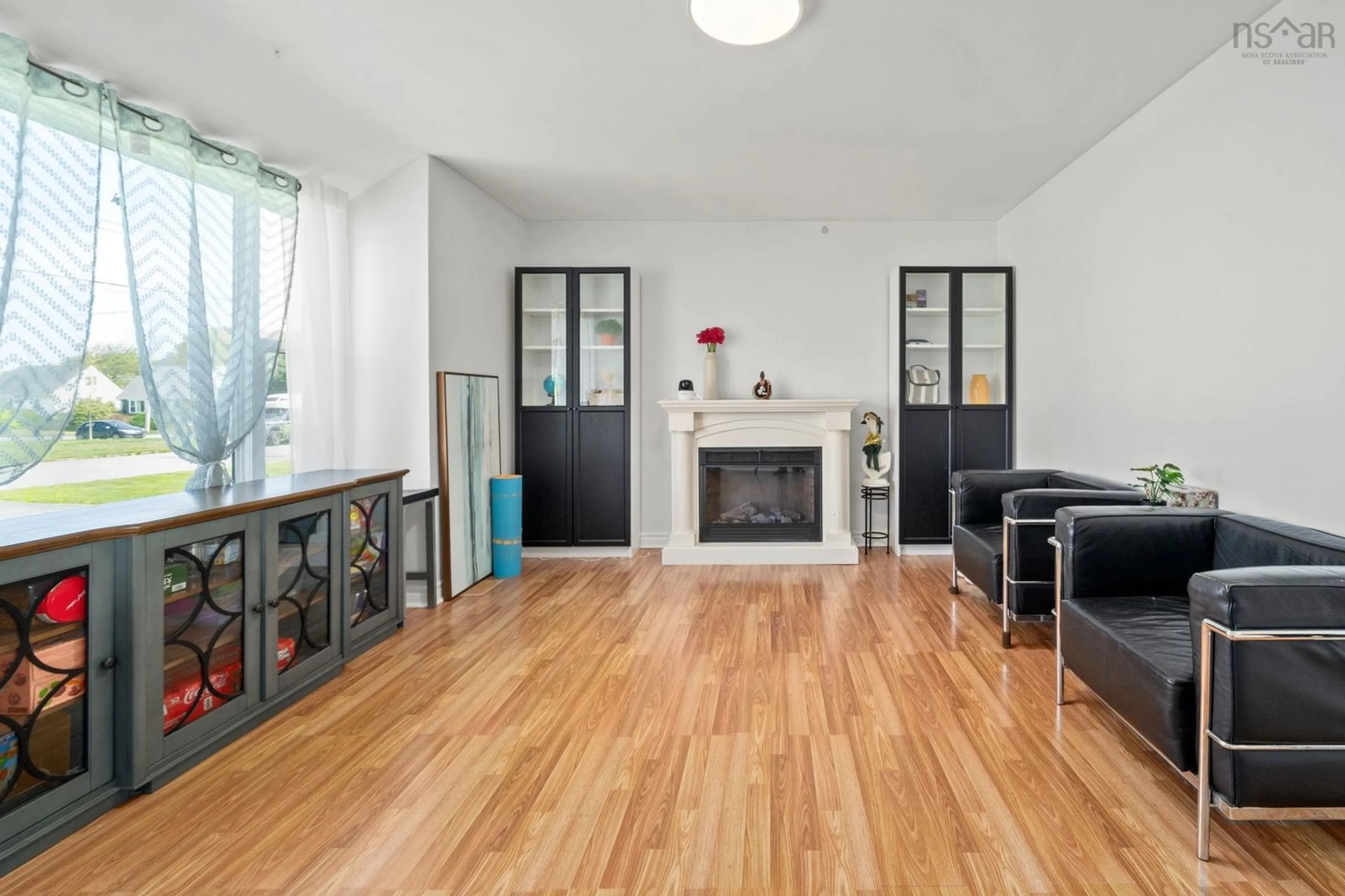 Living room with furniture, wood/laminate floor for 18 Avon Crescent, Spryfield Nova Scotia B3R 2E3